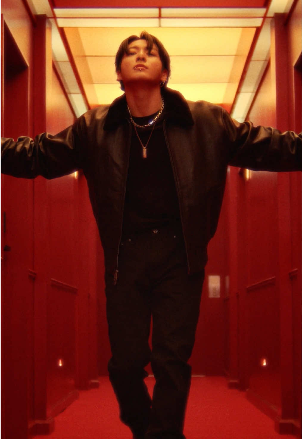 Jung Kook slips into leather. Warm up holiday nights in the cotton tee, tapered jeans and shearling-trimmed leather jacket.