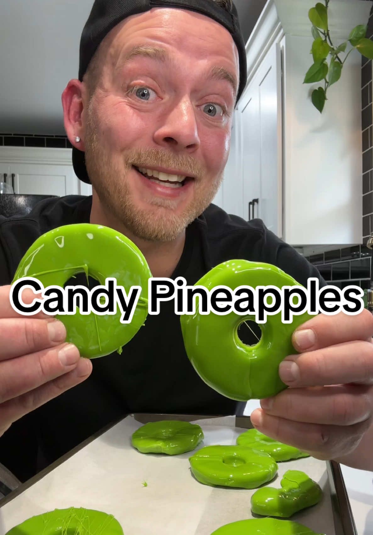 DIY Candy Pineapples 😁  #candy #pineapple #candyrecipe  #candypineapples #candyfruit  Candy Pineapples Sliced Pineapples (can works best) 2 C. Sugar 1/4 C. Corn Syrup 1/2 C. Water 1 drum of Flavor (I used watermelon) White food coloring (optional but preferred) Food coloring of choice (I used neon green) Crushed hard candy (optional) Drain and dry pineapple slices very well, add a toothpick or skewer and place them on a baking sheet and freeze til you're ready to dip.  In a saucepan add the sugar, corn syrup, and water bring to a boil over medium-high heat. Bring candy to 300°F. Once candy reaches temp turn off heat and mix in coloring and flavoring of choice. Dip half of a frozen pineapple, Drip, then place on parchment lined pan to harden, once hardened dip the other half, drip, and add crushed hard candy if using and place pineapple slice back onto parchment paper and allow them to dry for a few minutes. Store in airtight container in the freezer 😁