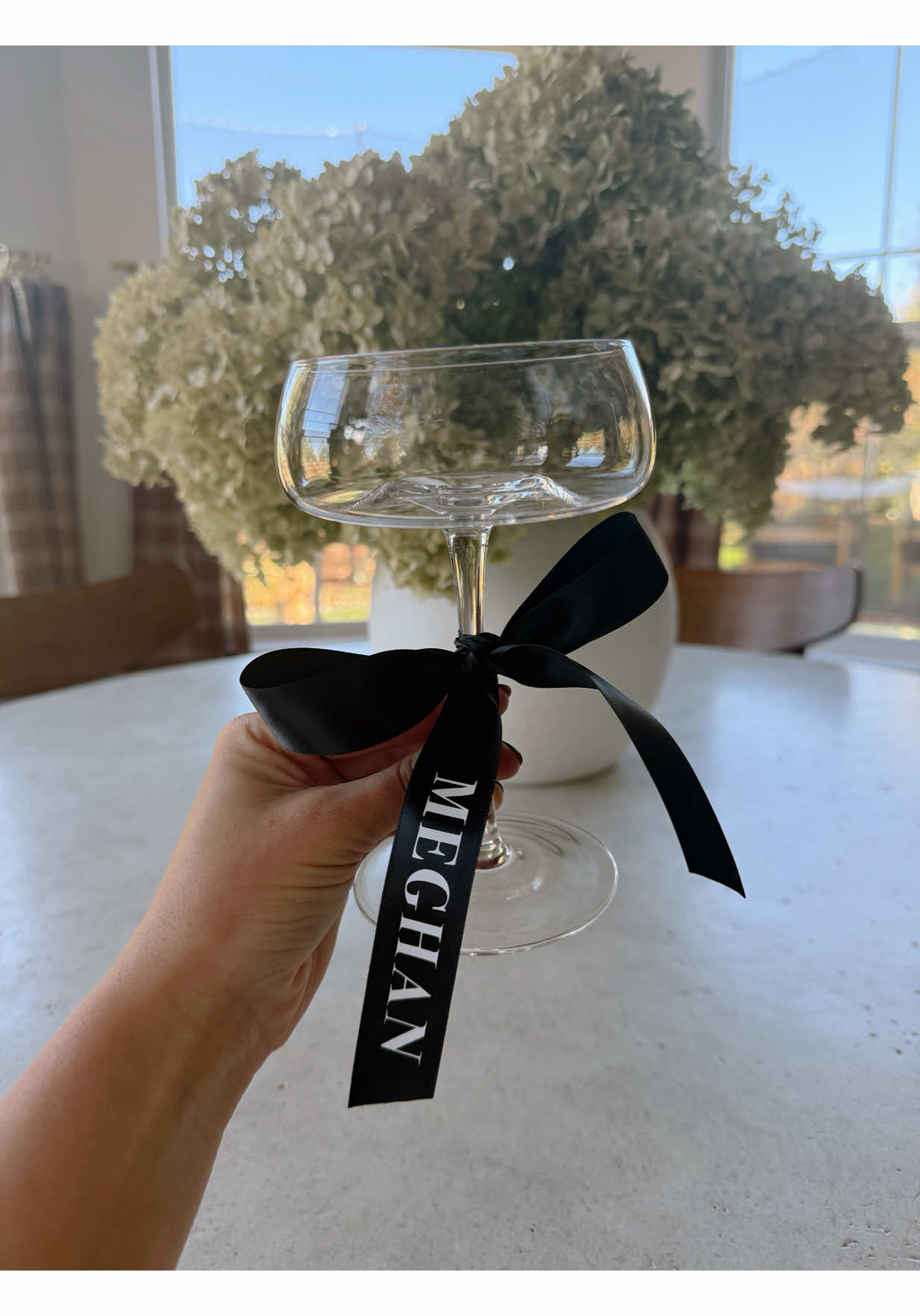 Holiday Hosting Tip ✨🖤 I am so excited this year to host my first Friendsgiving and of course I am going all out! Martinis will be involved and I wanted a cute way to tell our glasses apart. I made these custom name ribbons and tied them on to the glasses and they turned out so cute! #holidayhosting #partytips #friendsgiving #wineglassribbons #partydecor          