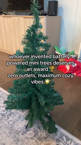 These little trees run on AA’s and pure holiday chaos 🎄 cheap, cute, and totally worth stealing batteries from the remote. #ChristmasDecor #HolidayFinds #CozyVibes #AffordableHome #TikTokMadeMeBuyIt