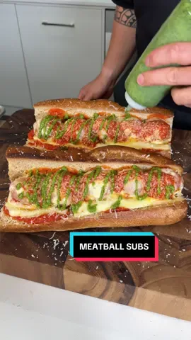 The only meatball sub recipe you’ll ever need 🥖 Save this recipe 👉🏽 Ingredients Meatballs 500g beef mince 500g Italian Style Pork Sausages (casings removed) ½ cup breadcrumbs ½ cup milk 1 egg 2 cloves garlic, finely grated ½ cup parmesan, finely grated Small handful Parsley, chopped 1 tsp Salt + ½ tsp cracked black pepper Tomato Sauce 2 tbsp olive oil 1 small onion, finely chopped 2 cloves garlic, sliced 3 × tins Diced Tomatoes  Fresh basil leaves 1 tsp Salt 1 tsp chilli flakes (optional) Pesto 1 bunch of Basil 1/3 cup parmesan, finely grated 2 tbsp pine nuts 1 clove garlic ⅓ cup extra virgin olive oil Pinch of salt and black pepper To Serve Large Baguette Mozzarella cheese   Extra parmesan, grated Method Combine the breadcrumbs and milk in a small bowl and leave to soak until soft. In a large bowl, add the beef mince, sausage meat, egg, garlic, parmesan, parsley, soaked breadcrumb mixture, salt, and pepper. Mix until just combined, then roll into golf-ball-sized meatballs. Heat olive oil in a pot and sauté the onion until soft, then add garlic and cook briefly. Stir in the diced tomatoes. Add a splash of water to the tins, swirl to loosen any remaining sauce, and pour it into the pot. Season with salt and torn basil leaves. Nestle the raw meatballs into the sauce. Cover and simmer gently for 60 minutes, gently stirring halfway until the meatballs are tender and cooked through. Remove the lid and allow to reduce and thicken for 30 mins. For the pesto by blend basil, parmesan, pine nuts, and garlic until along with olive oil, salt and pepper. Place the rolls in the oven for a few minutes to help soften up before cutting. Then spoon in your meatballs along with some sauce. Lay over cheese slices, then place under a hot grill until melted. Finish with parmesan and pesto, cut into individual subs and serve. Enjoy! #meatballsub #meatballs #sandwiches #fyp #recipes 