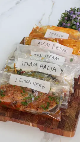 5 Resepi Perapan Ikan utk Kukus, Grill or Airfry Semua perapan ni boleh frozenkan untuk sebulan.Bila nak masak, defrost dulu baru masak.Cara masak saya ada cakap dalam video ok. 1. Kukus Halia & Bawang Putih Bahan perap: 5 ulas bawang putih, tumbuk kasar 2 inci halia, hiris halus 2 sudu besar sos tiram 1 sudu besar kicap cair 1 sudu besar minyak bijan ½ sudu teh lada putih serbuk 2. Thai Steam Bahan perap: 3 sudu besar air perahan limau nipis / lemon 2 sudu besar sos ikan 3 ulas bawang putih, cincang halus 2 biji cili padi, hiris ½ inci halia, tumbuk 1 sudu teh gula Daun ketumbar 3. Perapan Percik  Bahan perap: ½ cawan santan cair 1 sudu besar cili kisar 2 ulas bawang merah, tumbuk ½ inci halia, tumbuk 1 sudu besar gula merah Garam secukup rasa 4. Asam Pedas Bahan perap: 2 - 3 sudu besar pes asam pedas 2 -3  sudu besar pes ikan bakar 1 sudu besar minyak masak Daun kesum 5. Lemon Herb 3 ulas bawang putih 2 sudu makan perahan lemon 1 sudu kecil paprika 2 sudu kecil blackpepper 1 sudu kecil garam 1 sudu makan olive oil 1 sudu makan madu Daun sup ………..,………………… 1. Steamed Ginger & Garlic Marinade Marinade Ingredients: 5 cloves garlic, coarsely crushed 2 inches ginger, thinly sliced 2 tbsp oyster sauce 1 tbsp light soy sauce 1 tbsp sesame oil ½ tsp white pepper powder 2. Thai-Style Steam Marinade Marinade Ingredients: 3 tbsp lime or lemon juice 2 tbsp fish sauce 3 cloves garlic, finely chopped 2 bird’s eye chilies, sliced ½ inch ginger, pounded 1 tsp sugar Coriander leaves 3. Percik Marinade Marinade Ingredients: ½ cup thin coconut milk 1 tbsp chili paste 2 shallots, pounded ½ inch ginger, pounded 1 tbsp palm sugar Salt to taste 4. Asam Pedas Marinade Marinade Ingredients: 2–3 tbsp asam pedas paste 2–3 tbsp grilled fish paste 1 tbsp cooking oil Vietnamese coriander (daun kesum) 5. Lemon Herb Marinade Marinade Ingredients: 3 cloves garlic 2 tbsp lemon juice 1 tsp paprika 2 tsp black pepper #ikanperap 