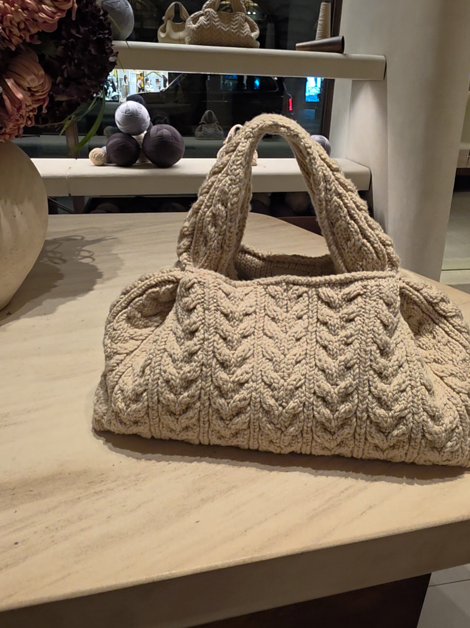 I saw this in the morning and had to turn back to look at in the @polene_paris window again ... could not resist popping in after work just to try it on. It's heavier than I thought it would be, in a good way, and now I cannot stop thinking about it. The mini was super cute too but probably a little impractical. tbf, the sales rep said that the wool used for this bag needs to be handled with care... am I ready for the responsibility?  #polene #handbag #fyp #merinowool #luxuryhandbags 