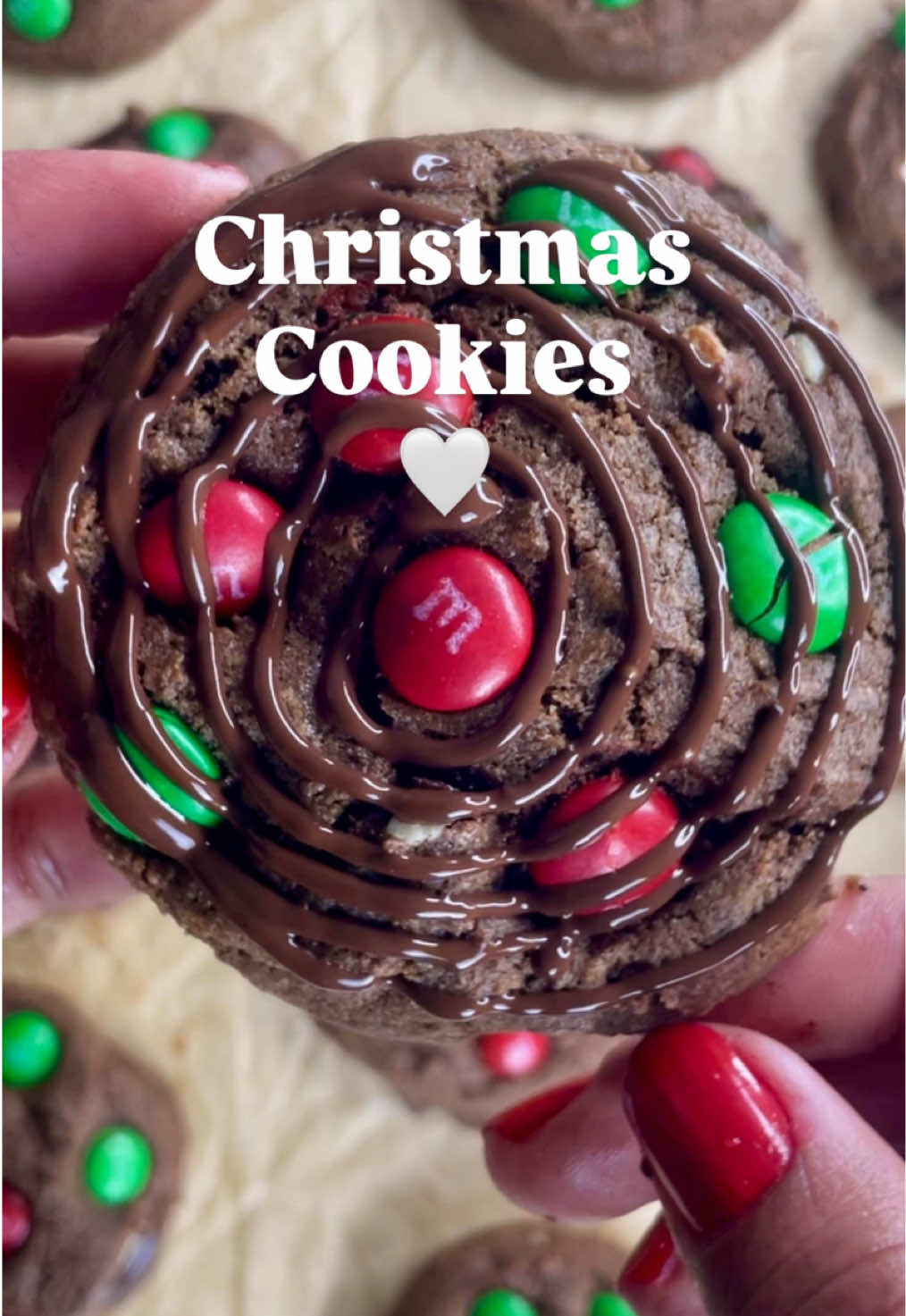 🎄❤️ Choco M&Ms Christmas Cookies 🍫✨ It’s time to spread some holiday magic✨one cookie at a time! 🫶🏼 Follow me for more sweet baking inspiration! ✨ Ingredients: -1/2 cup unsalted butter, softened -1/2 cup granulated sugar -1/2 cup brown sugar, packed -1 large egg + 1 egg yolk, room temperature -1 tsp vanilla extract -1/2 tsp baking soda -1 tsp  cornstarch -1 1/4 cups all-purpose flour -1/3 cup cocoa powder -Pinch of salt -2/3 cup chopped chocolate bar (milk or dark) -M&Ms (as many as your heart desires ❤️💚) 🍪 Instructions: Preheat your oven to 350°F (175°C). Line a baking sheet with parchment paper. Cream the butter and sugars: In a large bowl, beat together the softened butter, granulated sugar, and brown sugar until light and fluffy. Add wet ingredients: Mix in the egg, egg yolk, and vanilla extract. Beat until smooth and creamy. Combine dry ingredients: In a separate bowl, whisk together flour, cocoa powder, baking soda, cornstarch, and salt. Mix the dough: Gradually add the dry ingredients to the wet mixture. Stir until just combined 🙏🏼don’t overmix! Add chocolate: Fold in the chopped chocolate bar. Scoop & bake: Scoop dough balls (about 1½ tablespoons each) onto the prepared baking sheet. Gently press a few M&Ms on top for that festive look. Bake for 12–15 minutes, until the edges are set but the centers are still soft. Cool & enjoy: Let the cookies cool on the baking sheet for 5 minutes, then transfer to a wire rack. 🎁 Perfect with a cup of hot cocoa and your favorite Christmas movie! 💫 Share the joy! tag your cookie creations with #HolidayBakesByPalomaMedeiros #cookies #christmas #christmascookies 