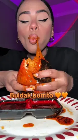 Eating a messy buldak burrito 
