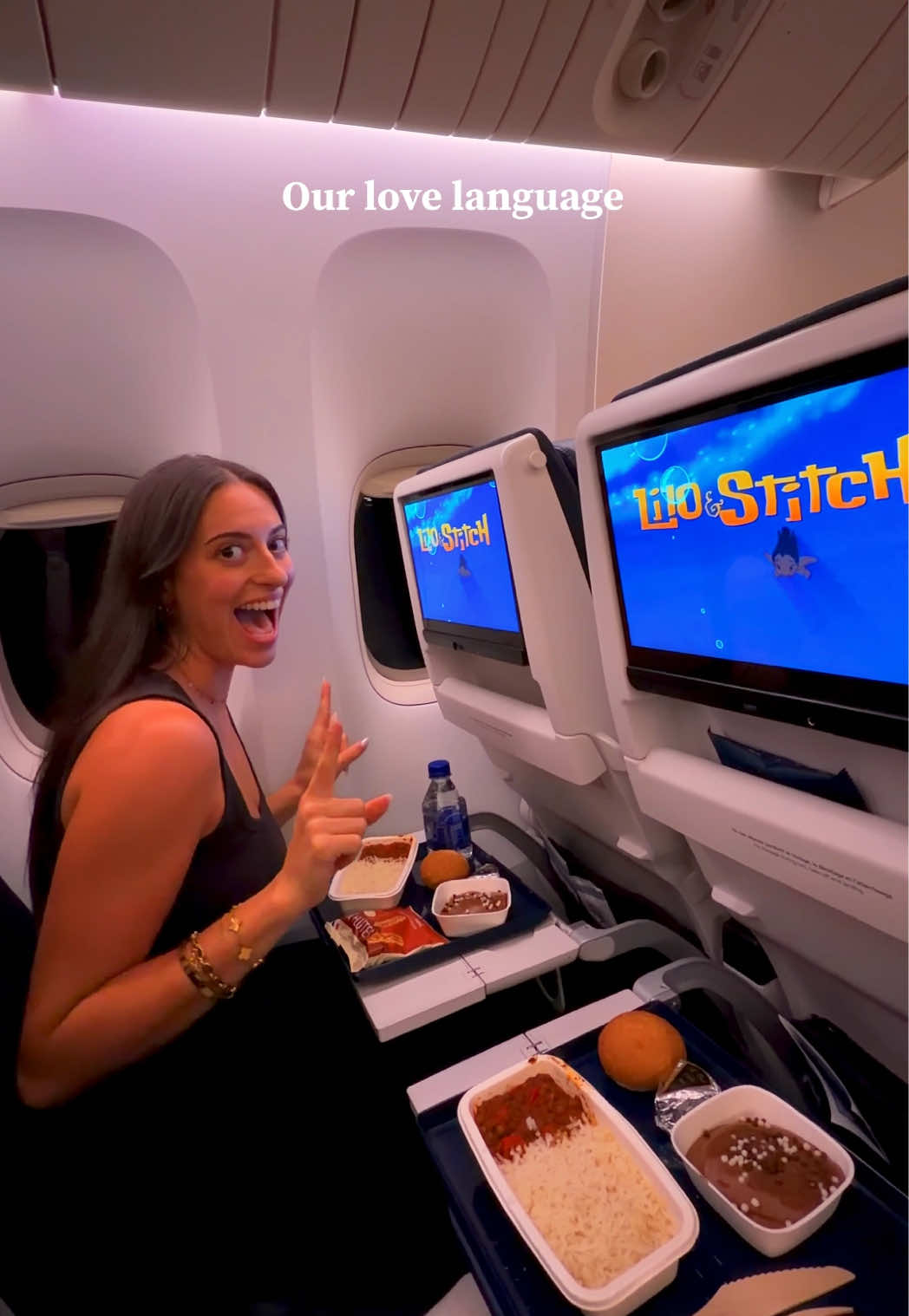 The best love language during a flight: watching a good movie while having our meal 😍✈️✨ The best animated movie: Lilo & Stitch 🌺🌴🩵 Send this to your travel partner 🫶🏼 #travelcouple #couplegoals #travellife #relationshipgoals #lovelanguage 