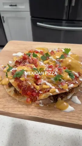 Never even tried one before tbh, but this was 🔥 Ingredients 📝 * flour tortillas  * Mexican crema  * Mexican 3 cheese blend  🥩 Taco Meat:  * 1 lb Ground beef  * Taco seasoning  * 1/4 onion  * 4 garlic cloves  🥫 Pizza Sauce:  * 2 tbsp tomato paste  * 1 cup tomato puree  * 1/2 cup water  * 1 tsp white vinegar  * 1 tsp sugar  * Salt & pepper  * Paprika  * Garlic and onion powder  * 1/2 tsp cumin  🫕 Nacho Cheese: * 3 tbsp butter  * 3 tbsp flour  * 1/2 cup milk  * 12 oz evaporated milk  * Chili powder  * Paprika  * 4 oz Colby Jack cheese  * 4 oz cheddar cheese  * Salt  * Splash of pickle juice  🫘 Beans:  Soak overnight then simmer for 1 hr (or until tender) * 1 lb pinto beans  * 1/4 onion  * 4 garlic cloves  * 2 bay leaves  Refrying:  * lard  * Little bit of bean water  * Chipotle paste  * Salt  #tacobell #blackstone #mexicanpizza #DinnerIdeas #capcut 