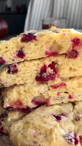 2½ cups all purpose flour ½ tsp salt 1 tbsp baking powder 2 tbsp granulated sugar zest of ½ an orange (or 2 tsp) 12 tbsp grated cold butter 1 cup buttermilk 1 tsp vanilla 1 egg 1½ cup fresh cranberries - Preheat oven to 350℉. In a large mixing bowl, mix together your dry ingredients of 2½ cups flour, 1 tbsp baking powder ½ tsp salt, 2 tbsp granulated sugar and orange zest. - With a cheese grater, grate your cold butter and mix into dry ingredients with your hands or mixing spoon until well incorporated throughout, reaching somewhat of a mealy texture. Add the 1½ cups of fresh cranberries, mix until combined throughout. - In a separate bowl, whisk together 1 egg, 1 cup buttermilk and 1 tsp vanilla. Add to the bowl of dry ingredients and mix until just combined. You want the dough to be just sticky enough to stick to your hands. Add more buttermilk 1 tbsp at a time if you feel it’s too dry. - Spread into a circle onto a lined baking sheet and cut into serving sizes, the same way you would a pizza. I cut into 8 slices. - Bake at 350℉ for 22-27 minutes or until lightly golden on edges and the middle is set, not jiggly. FOR THE ORANGE GLAZE: In a small bowl, combine ⅔ cup of powdered sugar with 1 tbsp orange juice. Whisk until smooth. Top scones with glaze once out of oven and have cooled for at least 5 minutes.  Enjoy! xo Hailey 🧡 #fyp #baking #scones #orangecranberry #homemade 