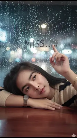 #แจกpromptฟรี #aiภาพสมจริง #gemiสร้างภาพโดยใช้แบบต้นฉบับที่แนบไปให้ Ultra-realistic close-up portrait of me resting my head on a table, with long naturally wavy hair flowing down. Clean natural makeup, soft glowing skin. One hand writes the word “Miss …” on a foggy rain-streaked glass window. Romantic rainy-night atmosphere, reflections of raindrops and blurred city lights outside. My eyes gaze deeply at the word, filled with longing as if missing someone. Cinematic depth of field, creamy bokeh, soft volumetric lighting. Photorealistic textures, realistic raindrop reflections, professional fine-art photography style. #เสิงสาง_โคราช 