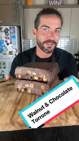 Walnut & Chocolate Torrone | A Rich, Crunchy Italian Delight  If you enjoy my recipes and would like to support my channel, you can donate any amount on my Ko-fi page — every gesture helps me keep creating content ❤️ 👉 ko-fi.com/cookingwithtucci This walnut and chocolate torrone is pure indulgence — a silky blend of dark, white, and chocolate spread, layered with crunchy toasted walnuts. Perfect as a homemade gift or an after-dinner treat, it’s a no-bake dessert that tastes like pure luxury. Ingredients (makes about 1kg): • 400g (14 oz) dark chocolate • 200g (7 oz) white chocolate • 250g (9 oz) chocolate spread • 200g (7 oz) toasted walnuts How to Make It: Toast walnuts at 180°C (355°F) for 5 minutes and set aside. Prepare a double boiler by placing one bowl over another with hot water underneath. Melt the dark chocolate first, then pour a thin layer into a plum cake mold. Coat all sides evenly and refrigerate for 10 minutes to set. In the same bowl, melt the white chocolate, then add the chocolate spread and toasted walnuts. Mix well until combined. Pour this mixture into the mold, level the surface, and refrigerate for at least 4 hours (or overnight) until firm. Slice into thick pieces and enjoy this heavenly, creamy, crunchy torrone — rich, sweet, and unmistakably Italian. Find more decadent Italian treats like this at 👉 www.cookingwithtucci.com #cookingwithtucci #torrone #chocolatetorrone #italianrecipes #italiandessert