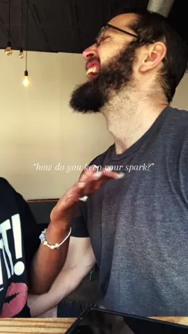 “Keep the spark alive” is THROWN around all the time, but rarely do I see the HOW part.  After years together (with kids, work, and a schedule that should’ve KILLED romance by now) This is what actually works for us: (after LOTS of trial and error 😂) 1.We live next door to each other. Two houses, side by side. By default, we have built-in alone time, and ZERO resentment about needing or requesting space (didn’t start that way!) especially since I work from home and our oldest is in virtual school. Having dedicated separate spaces is friggin lovely. 2.We have two kid-free nights every week.  Room for spontaneous dates, snuggles and LOUD spicy time, laying around butt naked getting REAL rest, and no guilt because good sitters, amazing family and community MATTER. *sidenote: if you’ve gotten this far, relationships are clearly important to you. Give a follow and join the Patreon to get more of our mistakes and messes as we share what we learn in therapy 🖤 	 3.We run this relationship like an empire. - Our weekly Ritual Check-In: a safe space to say what’s been building up in the week (frustrations, desires, everything in between.) Our exact framework is in the bio 🥰 - The Boring Meeting: routine but powerful. We go over schedules and mental load of every person in the house so no one burns out or is taking on mountains of invisible work  - The Creative Sesh: we DREAM together. hobbies, ideas, plans that keep us curious about each other and our individual worlds. Ima reader and bubba is a gamer and this is where we “catch up” on what the other person is doing Now this is just what works for US and it’s our current iteration for the people that we are right now it is BOUND to change, but we’ve learned that it’s not the busyness of life that gets in the way, it’s the lack of intention so we decided to be more intentional about it 🖤