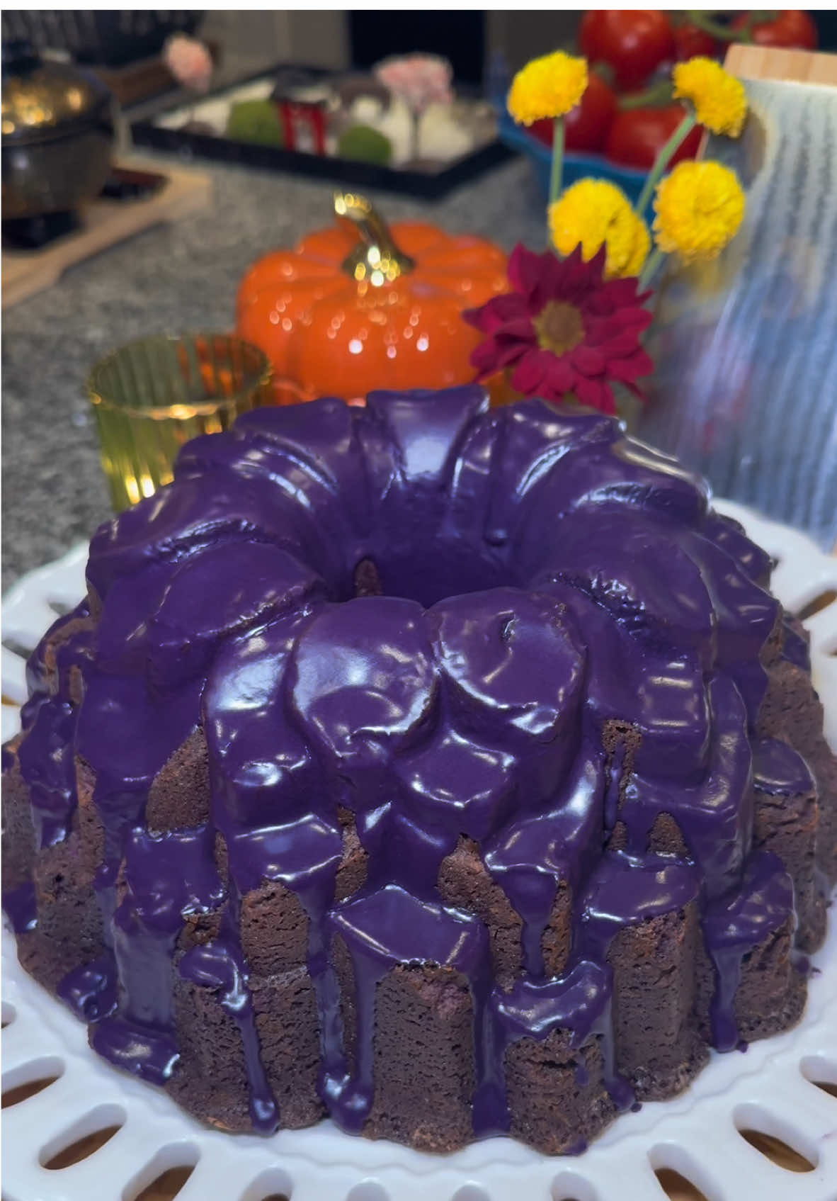 Ube Bundt Cake💜 Start out by preparing your dry ingredients.  In a large bowl, add: -375 grams of flour  -4 tbsp of cornstarch  -2 teaspoons of baking powder  Whisk this together, and set it aside.  Then add 1.5 cups of softened salted butter to a large mixing bowl.  Mix on medium speed for about 1 minute.  Then add in 2 cups of granulated sugar, and mix until it’s creamed for about 2 to 3 minutes.  Then slowly mixing in between each ingredient, add in: -4 room temperature eggs -1 teaspoon of vanilla extract  -1 tablespoon of Ube Extract  -1 cup of Purple Yam Jam (also known as Ube Halaya)  -1/2 cup of sour cream  Then slowly add in the dry ingredients, along with 3/4 cup of room temperature whole milk, alternating adding each and mixing in between.  Then get your favorite Bundt pan and coat it with softened butter, and a light dust of flour.  Add in all of your batter, and give it a few taps on the counter. (This gets out any air bubbles)  Then bake at 350 degrees for 45 to 55 minutes or until a toothpick runs clean.  Let this cool for 10 minutes in the pan, then transfer it to a cooling rack to cool for 1.5 hours before adding the glaze.  Ube Glaze Recipe In a large bowl add: -4 tablespoons of melted butter (lukewarm)  -1/4 cup of whole milk (room temp)  -2 tablespoons of heavy whipping cream (room temp)  -1 teaspoon of vanilla extract  Whisk this together, then slowly mix in 300 grams of sifted powdered sugar.  Then whisk in a 1/2 teaspoon of Ube Extract. Start with the 1/2 teaspoon, and add more if you want it to have more color/flavor. (I actually added 1 teaspoon of the extract in this video because I wanted a deep purple color for Halloween🎃)  Once the cake is completely cooled, pour on the glaze (while the cake is on the cooling rack) and let it set in the fridge for 30 minutes.  Enjoy💜 #cake #food #Recipe #ube #baking 