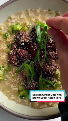 🫚 Savory Ginger Scallion Oats with Brown Sugar Hoisin Tofu, for those days where I still want the benefit of oats, but a sweet breakfast bowl just won’t do. #ad @One Degree Organic Foods These oats also happen to be high-protein and great to meal prep for a week of satisfying meals. #plantbasedrecipes #tofu @onedegreeorganics makes packing in more nutrition at breakfast easier because their oats are sprouted. Sprouting helps to make the nutrients within grains, seeds, and legumes more bioavailable, which means you are absorbing more nutrients you need. It also helps that these oats are well trusted and truly transparent. They are third party tested and are organic, glyphosate-free, and gluten-free.  Hoisin Tofu 1, 16oz package super firm tofu 2 tbsp + 1 tsp tamari 1 tbsp Chinkiang vinegar or rice vinegar 1 tsp ground coriander 1 tsp garlic powder ½ tsp five spice 1 1/2 tbsp potato starch 1 1/2 tbsp avocado oil  2 tbsp hoisin 2 tsp light brown sugar Ginger Scallion Oil  3 tbsp avocado oil 2 scallions, thinly sliced 1/2 inch fresh ginger, minced Kosher salt ½ tsp granulated sugar (optional) Oats (1 serving or scale up if meal prepping) 1 scallion, thinly sliced (whites and greens separated) 2 cloves garlic, minced 2 ½ cups vegetable broth or water 2 slices of ginger 2 dried shiitake mushrooms 1 star anise ½ cup rolled oats Crushed sesame seeds Preheat oven to 425F. Tear tofu into 1-inchunks in a large airtight container and coat with 2 tbsp tamari, vinegar, coriander, garlic, & five spice. Seal container and give a shake to coat. Add potato starch and oil, seal and shake again to coat. Transfer to a baking tray, making sure there is space between each piece. Bake for 20 mins. Flip and bake 10 mins. For the glaze, mix remaining 1 tsp tamari, hoisin, and sugar then pour over the tofu & toss to coat on  tray. Bake for 5 mins and set aside.   For scallion oil, heat oil in a small saucepan, about 2-3 mins. To a heat proof bowl add the scallions, ginger, a generous pinch of salt and sugar. Pour the oil over the scallions then mix and set aside.  Use same pan for oats. Add the white scallions and garlic to the pot and saute for 2-3 mins. Pour in broth then add ginger, mushrooms, and anise. Bring to a boil. Add oats, reduce heat to a simmer, continuing to stir the oats for 10 minutes or more until they are at your desired thickness. Cover until ready to serve. Discard ginger, mushrooms and anise, then serve in a bowl topped with a drizzle of scallion oil, a portion of tofu, and the sesame. 