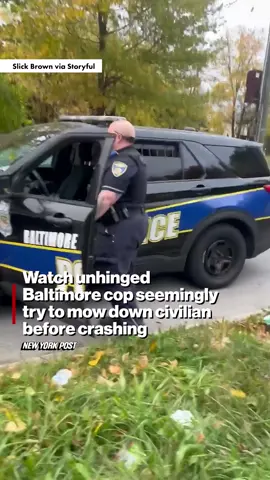 Shocking video shows the moment a Baltimore cop almost hit a pedestrian with his patrol vehicle. The officer even drove over a grassy lot and sidewalk to try and get to the man.