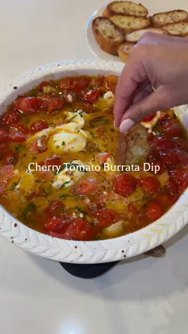 🍅 Cherry Tomato Burrata Dip Ingredients For the dip: Cherry tomatoes, olive oil, garlic, salt, pepper, oregano, red chili flakes, parsley flakes, fresh Parmesan cheese, burrata cheese, fresh basil. For the garlic bread: Baguette, salted butter (room temperature), crushed garlic. ⸻ Method 	1.	Preheat the oven to 450°F (232°C). 	2.	In a baking dish, combine cherry tomatoes, olive oil, garlic, salt, pepper, oregano, red chili flakes, and parsley flakes. 	3.	Toss well and bake for 30 minutes until the tomatoes are blistered and bubbly. 	4.	Remove from the oven and sprinkle with fresh Parmesan cheese. 	5.	Place the burrata in the center while it’s still hot, letting it melt slightly. 	6.	Garnish with fresh basil leaves. For the garlic bread: 	1.	Mix salted butter and crushed garlic together. 	2.	Spread on sliced baguette pieces. 	3.	Toast or bake until golden brown and crispy. ⸻ Serve warm with the garlic bread and enjoy that creamy, cheesy, roasted perfection 🤌✨ #EasyRecipes #homemaderecipes #FoodLover #comfortfood #viralrecipes 