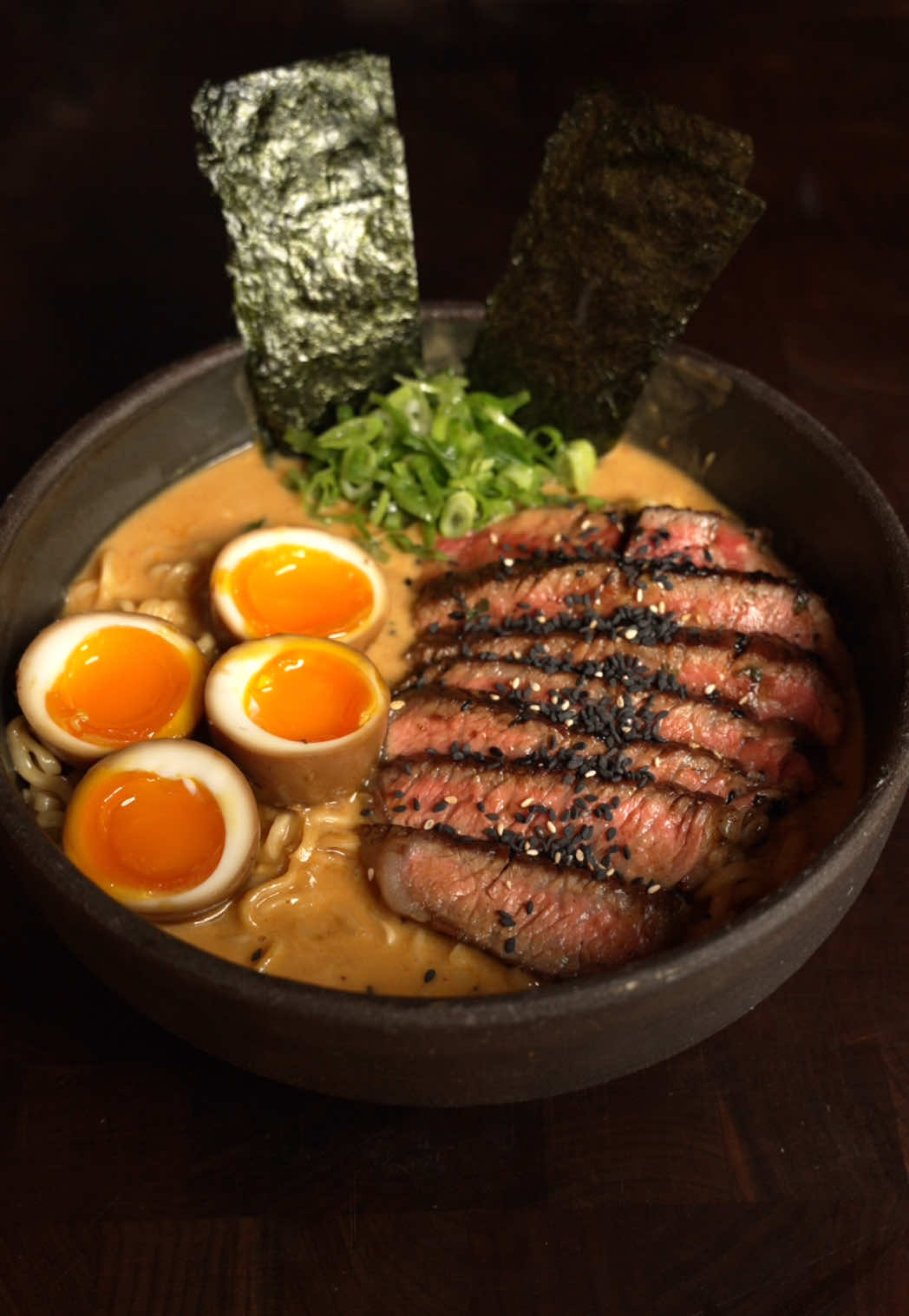 Steak Ramen 🍜 #steak #ramen #soup  INGREDIENTS Soy Marinated Eggs * 4 soft-boiled eggs (6½ minutes, ice bath) * 1 cup soy sauce * ½ cup water * 2 tbsp mirin Gochujang Compound Butter * 4 tbsp softened butter * 1 tbsp gochujang * 1 tbsp toasted sesame seeds * 1 green onion, very thinly sliced * Pinch of salt * 1 ribeye Ramen broth: * 2–3 cloves garlic, minced * 1-inch piece ginger, minced * 1 tbsp laksa paste * 1 tbsp miso paste * 2 tsp soy sauce * 2 tsp mirin * ½ can coconut milk  * 1–1½ cups chicken broth * Cornstarch slurry (1 tsp cornstarch + splash water) * 1 portion ramen noodles * garnishes: extra scallions, toasted sesame, nori