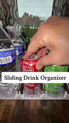 This sliding drink organizer just made my fridge 10x neater! 🧃✨ It automatically brings the next can forward so you never have to dig around again. Perfect for soda, sparkling water, or juice boxes — and it saves so much space!  #TikTokShopFinds #FridgeOrganization #DrinkDispenser #HomeEssentials #tiktokmademebuyit 
