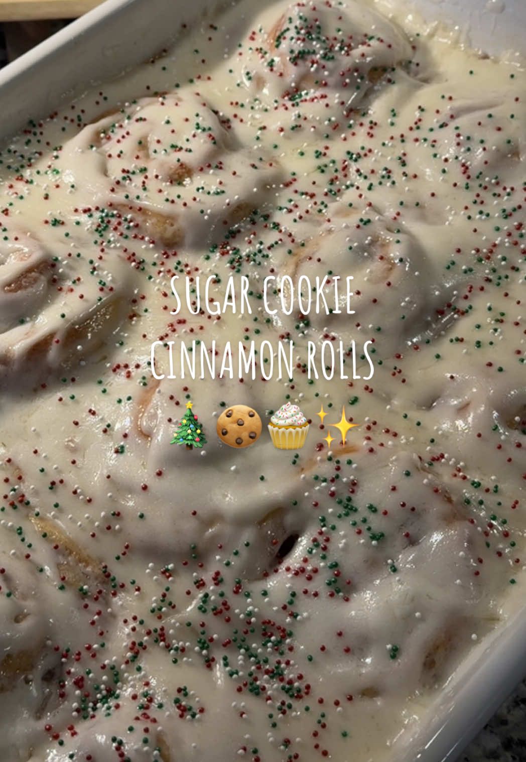 Is it time yet??! 🎄🍪🧁✨ these rolls are filled with cookie dough truffles, sugar cookie mix, and crushed sugar cookies — sugar cookie overload!!  🎄recipe🎄  cookie dough truffles: ﻿﻿½ cup unsalted butter (room temperature) ﻿﻿¾ cup granulated sugar ﻿﻿1 tsp vanilla extract  ﻿﻿2 cups all-purpose flour 14 ounces sweetened condensed milk ½ tsp. salt cinnamon roll dough: ﻿﻿1/2 cup water (warm) ﻿﻿1 tbsp active dry yeast ﻿﻿1/2 cup whole fat buttermilk (room temperature) ﻿﻿1/2 cup + 1/2 tsp granulated sugar (divided) ﻿﻿1 tsp. salt ﻿﻿1 tsp. vanilla extract ﻿﻿2 large eggs ﻿﻿6 tbsp unsalted butter (melted and slightly cooled) ﻿﻿3 1/2-4 cups all purpose flour Filling: ﻿﻿6 tbsp unsalted butter (super soft) ﻿﻿1 cup granulated sugar ﻿﻿2 tbsp cinnamon ﻿﻿1/2 cup dry Sugar Cookie Mix Buttercream frosting: 1 cup unsalted butter (room temperature) 1 tsp vanilla extract  7-8 cups powdered sugar About ½ cup of milk (add less or more depending on consistency)  Optional: holiday sprinkles on top!  🎄instructions🎄 Cookie Dough Truffles: -Using a stand mixer (or a large bowl and hand mixer ), cream together the butter and sugar until light and fluffy. -Add vanilla extract.  -With speed on low, add flour, alternating with condensed milk, and add the salt. Beat until well combined.  -Roll into 1-inch balls and place in fridge until ready to use. You will have extra cookie dough, can use them in other recipes or so eat on its own!  Cinnamon roll dough:  -Using a stand mixer, with the paddle attachment, add warm water, yeast, and granulated sugar. -Allow yeast to bloom for 5-10 minutes, the batter will puff up. -Add in buttermilk, granulated sugar, melted butter, eggs, vanilla extract, and salt. Mix until fully combined. -Switch to a hook attachment and add in 2 1/2 cups of the flour.  -Then add another 1 cup of flour. Knead mixture until combined.  -Continue to knead on low speed about 5 - 6 minutes while adding a little more flour as needed to reach a soft and moist dough, 10-12 minutes by hand. -Transfer dough to an oiled bowl, cover with a clean kitchen towel or plastic wrap. Let rise in a warm place until doubled in size, 1- 1 1/2 hours. -Once the dough has doubled in size then punch dough down. -Dust a working surface lightly with flour. -Roll dough out into an 20 by 18-inch rectangle. -Spread the softened butter evenly over entire surface (hands work best). For the Filling: -In a medium sized bowl, add the granulated sugar, cinnamon, and sugar cookie mix. Mix until well combined.  -Sprinkle and spread cinnamon sugar cookie mixture evenly over butter layer.  -Chop and crush the sugar cookies and sprinkle over evenly on top of the cinnamon sugar cookie mixture.  -And then add about 30 cookie dough truffles over the top. You can use less or more if desired. -Beginning on an 18-inch side tightly roll dough into a cylinder. Cut into 12 equal portions. Or cut individual strips. And roll one by one, tightly.  -Grease a 9-x-13-inch pan with softened butter, and place the cinnamon rolls.   -Cover with clean kitchen towel or plastic wrap loosely. -Let rise in a warm place until doubled in size, about 1- 1 1/2 hours. -Preheat oven to 350° near the last 20 minutes of rolls rising. -Bake rolls for 25-30 minutes. -When rolls are done baking, add  the butter and two cups of powdered sugar in a large bowl. Cream until well combined.  -Add vanilla extract.  -Continue to add powdered sugar 1 cup at a time.  -When it starts to get too thick begin to add the milk. -Keep adding powdered sugar until you reach desired consistency. -Frost the rolls and add holiday sprinkles. Enjoy!!  #sugarcookie #cinnamonroll #christmasbaking #christmascountdown  #creatorsearchinsights 