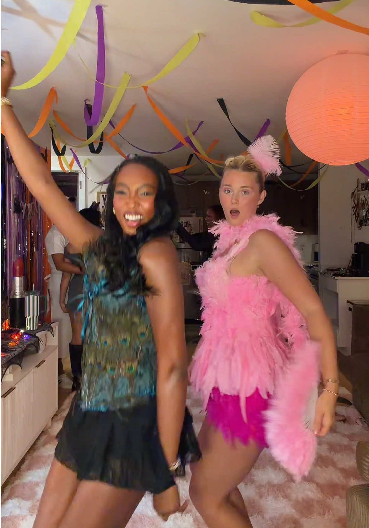 Guys we made our tops 🤪🦚🦩#halloween #bestie #peacock #flamingo