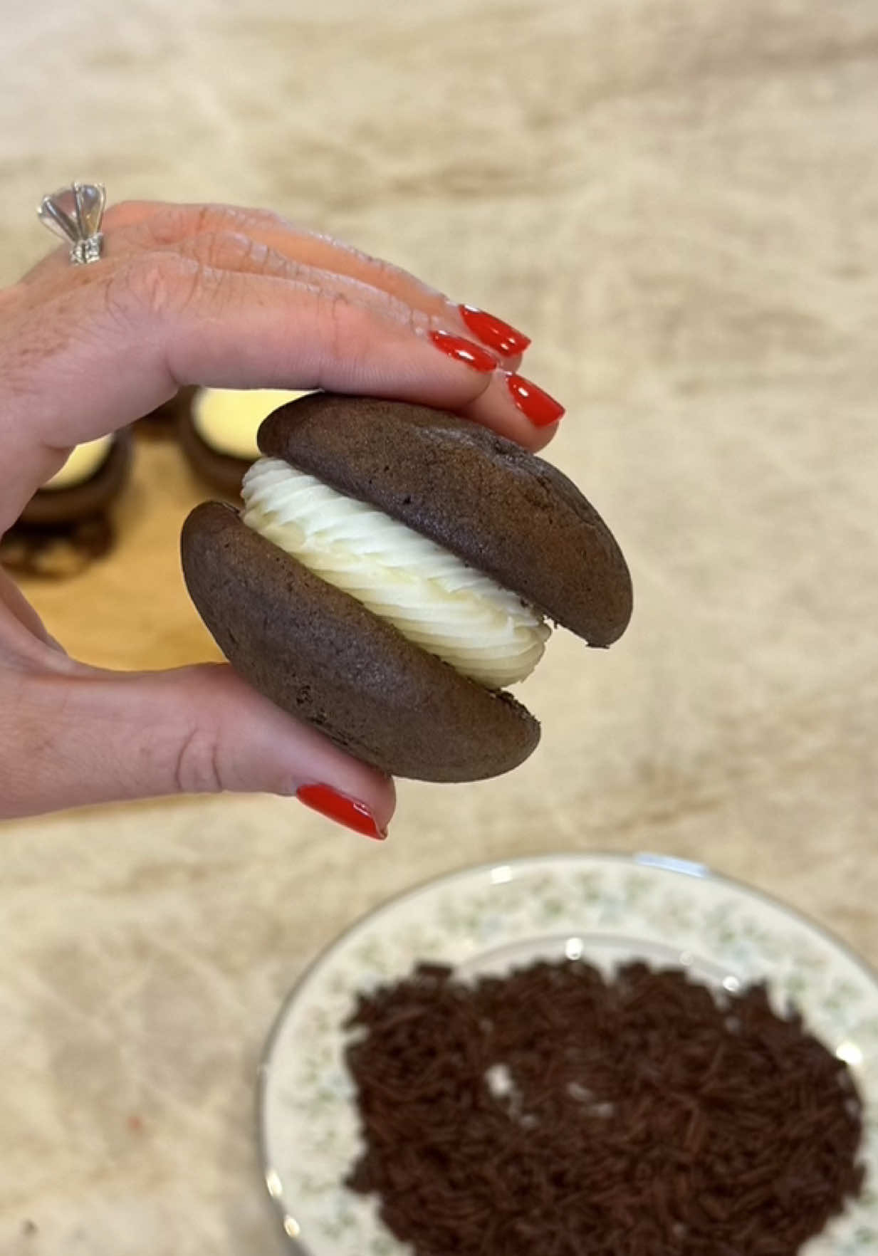 Replying to @user6954084109295 Old-fashioned whoopie pies, maybe something to consider for your weekend baking 💕 RECIPE: Ingredients for the cookie:  255g all-purpose flour (approx 2 1/4 cups) 55g cocoa powder (approx 1/3 cup) 1 1/2 tsp baking soda 1/2 tsp salt 1/2 cup butter, room temp 200g sugar (1 cup) 1 egg 1 tsp vanilla extract 1 cup buttermilk Ingredients for the marshmallow buttercream filling: 4 oz marshmallow creme 10 tbsp unsalted butter, room temp 155g powdered sugar (approx 1 cup + 1 tbsp) 3/4 tsp vanilla extract 1/4 tsp salt Directions: 1. Preheat oven to 350° F and line a cookie sheet with parchment paper. 2. Measure and sift the flour, cocoa powder, baking soda, and salt in a medium-sized bowl and set aside. 3. Cream the butter and sugar together until pale in color. Add the egg and vanilla and continue mixing until combined. Scrape the bottom of the bowl so all ingredients are incorporated. 4. With the mixer on low, slowly add the dry ingredients to the butter mixture, mixing until a bit crumbly. Then, carefully stream the buttermilk into the mixing bowl. 5. Drop spoonfuls of dough onto a parchment-lined cookie sheet, leaving enough room for the cookies to spread. I have found that scooping 15-20g of dough is the perfect size (a small cookie scoop works great for this type of dough as it is a wet dough). 6. Bake at 350° F for 8-10 minutes or until the tops don’t look wet. Marshmallow Buttercream Filling: 1. Cream the marshmallow creme and butter together until the mixture is light and fluffy, approximately 5 minutes. 2. Scrape down the sides of the bowl and add the powdered sugar, vanilla, and salt. Continue mixing on low until well combined.  3. Let cookies cool completely before adding the filling! 