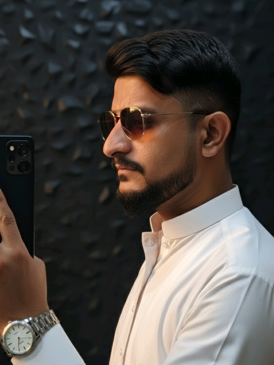 #creatorsearchinsights  Ultra-realistic close-up mirror selfie portrait of a young man standing in a dark modern room with a black textured wall background. The camera captures him from the side profile, very close — just like a cinematic frame — his face, shoulder, and phone filling the shot. He holds a Samsung Galaxy S25 Ultra black near his cheek, fingers resting naturally on the phone edge, as he looks at his reflection with a soft, confident expression. His short black hair is style —, giving sharp volume and clean edges under the soft light. He’s wearing a White Qameez , with smooth shiny fabric reflecting subtle highlights, giving a rich elegant vibe. He also wears brown sunglasses, a silver watch, completing his classy modern style. The lighting is soft and moody, with a warm glow sliding across his cheekbone, nose, and lips — creating deep cinematic shadows and golden reflections. Every detail — hair texture, fabric folds, skin tone, jewelry shine, and phone reflection — appears 8K ultra-detailed, cinematic, and realistic. The pose, camera angle, and framing must be identical to the reference image, only gender swapped (male), maintaining the same vibe, lighting, and composition. #Prompt #gemini #growmyaccount #CapCut 