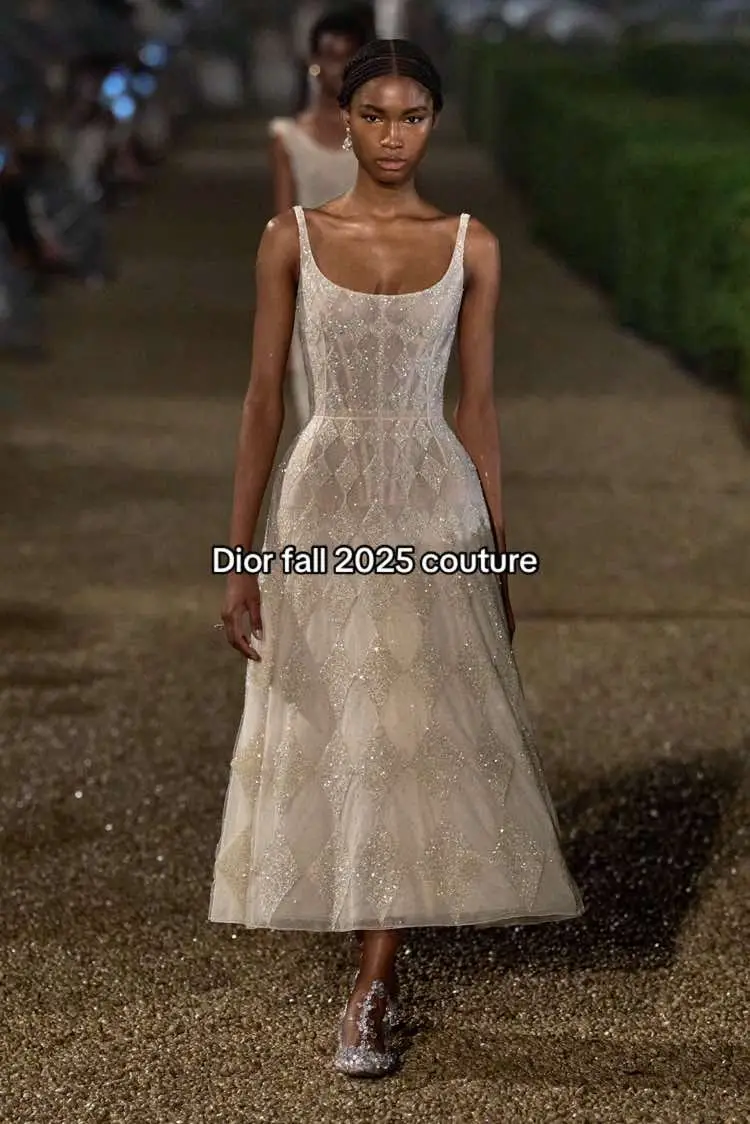 #dior #couture #Runway  The Fall 2025 haute couture collection by Maria Grazia Chiuri for Dior unfolded as a poetic return to the designer’s Roman roots, staged at the historic Villa Albani Torlonia. It opened with ultra-tailored double-faced cashmere ensembles—tailcoats and trouser suits described by Chiuri as “you can only make these by hand.”   From there the collection shifted into semi-sheer dresses adorned with 3D floral lace, gilded latticework and art-deco frills: an homage to couture’s craft alongside Chiuri’s less-corseted silhouette ideal.   The palette was predominantly ethereal—ivory, soft grey and shimmering metallics—while references to ecclesiastical tailoring (a cardinal-red coat, deep lace hems) and Roman armour suggested strength behind the softness.   Overall the collection felt like a layered dialogue between heritage and personal expression: couture not simply as spectacle, but as a woman’s armour and a celebratory gesture of place, memory and craft.  