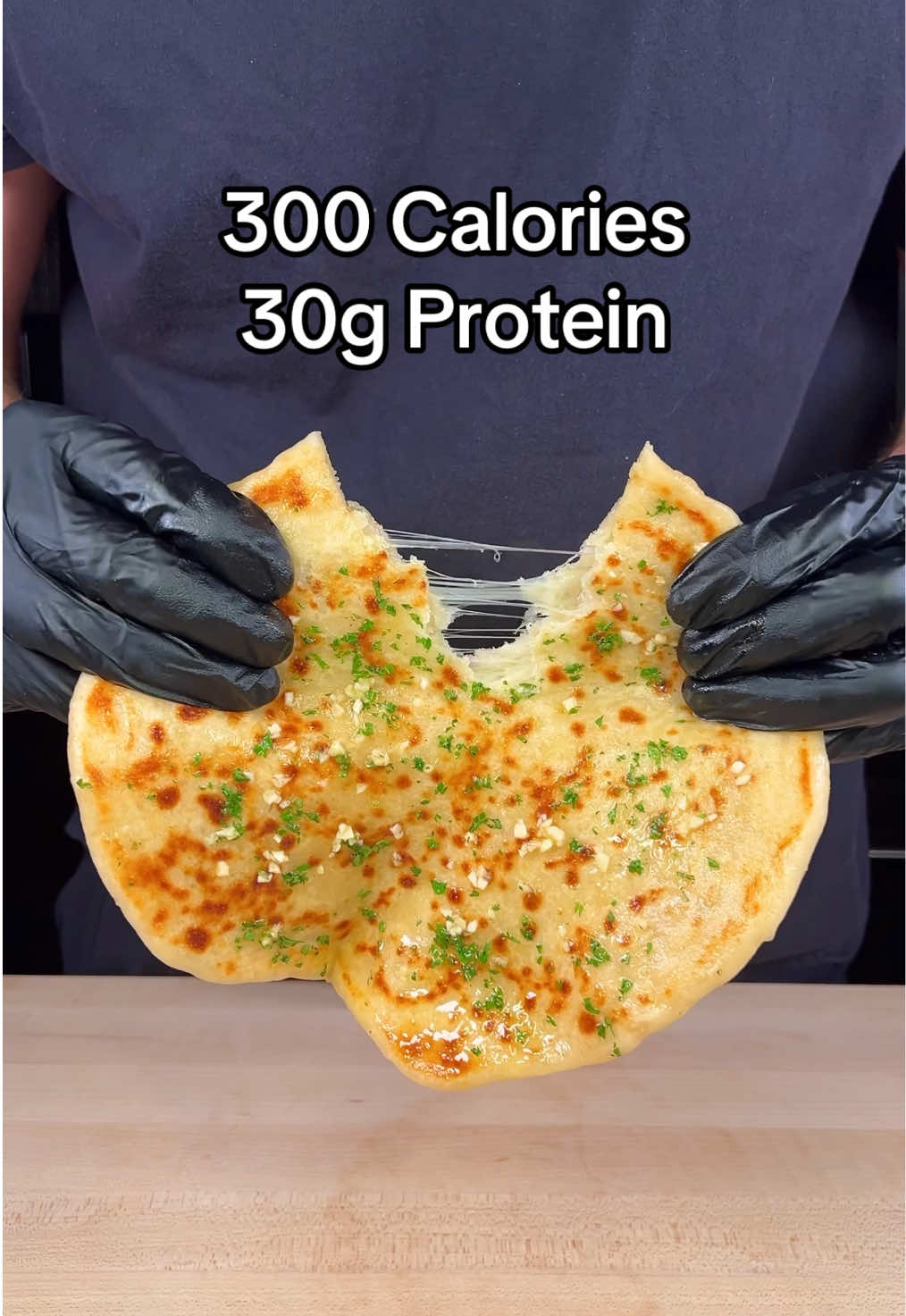 Cheesy Garlic Butter Naan (Makes 10 Naans)  Macros Per Naan:  - 300 Calories - 30g Protein  - 42g Carbs  - 1g Fat  Ingredients :  - Self Rising Flour (500g) - 0% Fat Greek Yogurt (520g)  - 2 Tbsps Garlic Salt (30g) - 5 Cups Fat Free Mozzarella (560g) - 4 Tbsps Melted Light Butter (60g) - 4 Tbsps Minced Garlic (40g) - Fresh Parsley (10g) Freezing Instructions ❄️: 1. Wrap the naans in aluminum foil or put them in an airtight freezer bag 2. Place them in the freezer and keep frozen for up to 3 months Reheating Instructions🔥:  1. Take out a frozen naan and wrap it in a wet paper towel  2. Microwave it on a plate for 1-2 minutes 3. Toast in a pan or air fry for a few minutes if you like it crispy