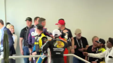 Noah Lewis via X .@/austindillon3 drags @/WilliamByron back over to meet @sydney_sweeney before leaving the Drivers Meeting.  Dillon told Sweeney that “Travis and Taylor would have nothing on you two!” 😆 #nascar #phoenix