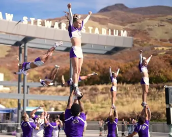 Football game stunts with Weber #cheerleading #stunt #cheer #tumble #flip        
