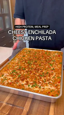 Cheesy Enchilada Chicken Pasta Per Serving (Makes 13) 580 Calories 51g Protein 65g Carbs 14g Fat Sheet Pan Meal Prep Series Episode 8 — Enchilada Chicken: 1344g (48oz) chicken breast 784g (28oz) red enchilada sauce 392g (14oz) fire roasted tomatoes 420g (15oz) tomatillo salsa 2 taco seasoning packets Veggies: 3 bell peppers 1 red onion Cheese Sauce: 900g (32oz) 2% cottage cheese 120g (4oz) extra sharp cheddar 240g (1 cup) milk 4 slices American cheese Salt/pepper to taste  Pasta: 896g (32oz / 2lbs) pasta of choice Cheese Topping: 227g (8oz / 1 bag) reduced fat mozzarella — SHEET PAN OPTIONS  Option 1.) High-Sided Sheetcake Pan (NordicWare) 17.3”x12.4”x2” Option 2.) Handi-Foil Medium Rack Roaster Pan 15”x11”x3” (Disposable foil roasting pan you can find in virtually any grocery store) — The high sided sheet pan may have just revolutionized the sheet pan series… this is pure comfort food, and makes 13 POUNDS of food in one batch. Using a deeper sheet pan like this one competes with the slow cooker as one of the most useful meal prepping tools you can have in your kitchen. I use the high-sided sheetcake pan from NordicWare - but they also have an even larger model (“The Big Batch Pan”) for increasing the volume of food you can make at once.  Foil roasting racks (sold in most grocery stores) also come in various large sizes, and can work if you’d rather not invest in a new sheet pan before testing out these style of recipes! If you use these, I recommend placing it on top of a sheet pan for stability when removing/adding to the oven. — #stealthhealth #mealpreprecipes #highproteinrecipes 