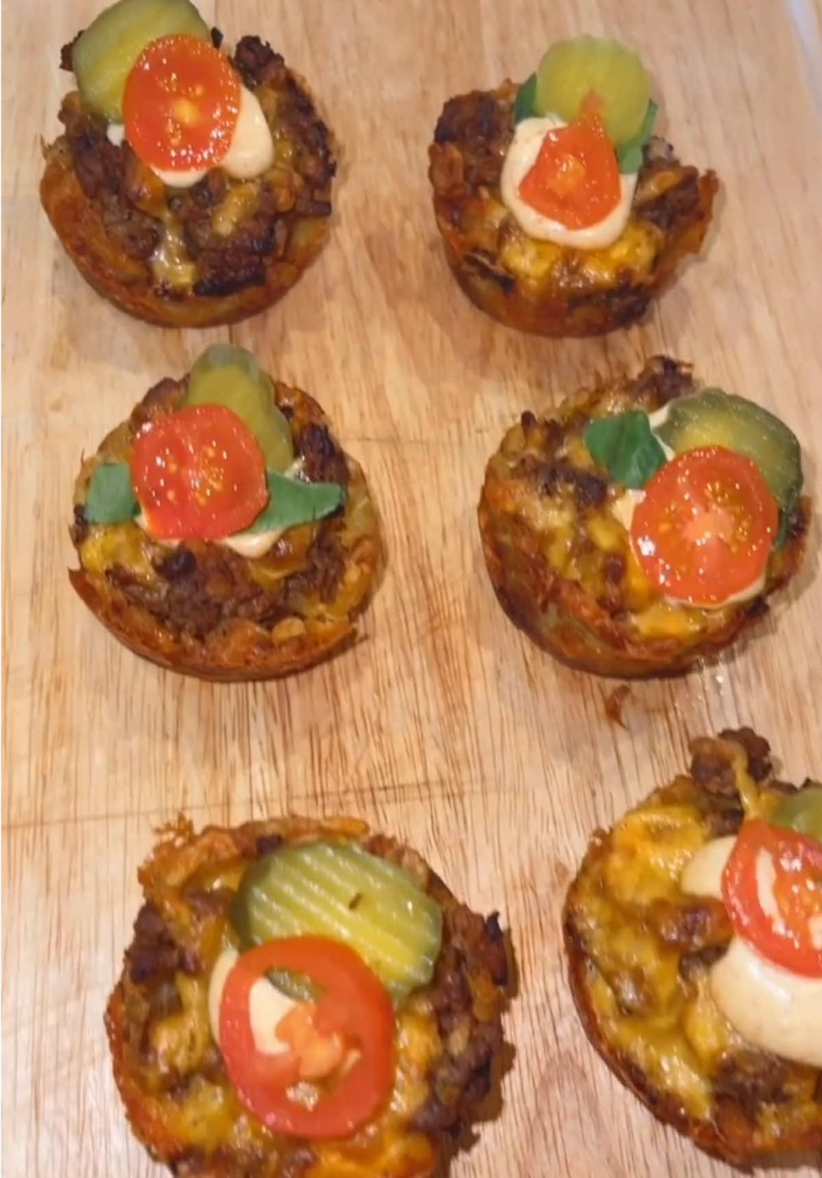 Looking for a game day appetizer?🏈 Save this video because these👏🏼were 👏🏼delicious👏🏼 • CHEESEBURGER TOTS 🍔 Tater Tots, frozen 1 lb Ground beef 1/2 c Onion or onion powder Salt and Pepper to taste 2 tbsp Mayonnaise 2 tbsp Yellow mustard 2 tbsp Ketchup 2 tbsp Pickle relish 1 c Cheddar cheese, , shredded Note: You can use more or less of any of these condiments according to your taste! Mini Pickles for garnish SPECIAL SAUCE✨ 1/2 c Mayonnaise 2 tbsp Yellow mustard 1 tsp Paprika 1 tsp Onion powder 1 tsp Garlic powder Baked the tater tots, then stamp them down into a bowl shape- easiest to do in a cupcake pan, add cooked ground beef. Top with cheese, then bake it in the oven until cheese is melted! Add your favorite toppings and have the most delicious and cutest appetizer for your next game day party or tailgate!  #quickmeals #cheeseburger #classic #comfortfood #delicious               