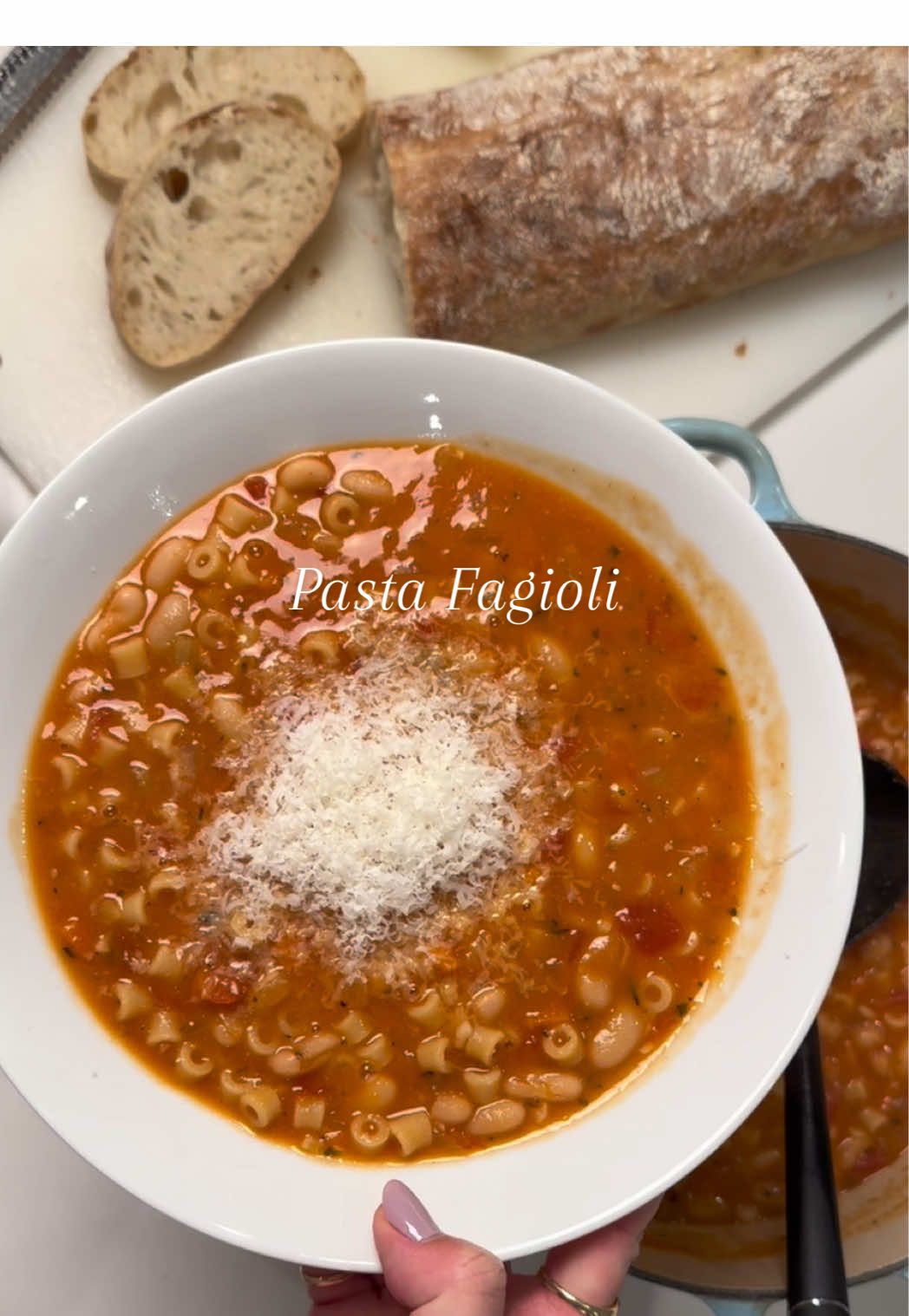 Is Pasta Fagioli a perfect soup?? I think so! I’ve been perfecting this recipe my whole life. Enjoy!! #souprecipe #italianfood #italian #EasyRecipe #cookingtiktok   Olive Oil + Butter 1 Medium Onion (Finely Diced) 2 Carrots (Finely Diced) 1 Rib Celery (Finely Diced) Salt + Pepper 4 Cloves Garlic (Minced) 2-3 Springs Rosemary (Minced, Save Stems) 1 Bundle of Thyme (Tied for easy removal) 1 Bay Leaf 1-2 Tablespoons Tomato Paste 28oz Crushed Tomatoes 2 15oz Cans Cannelini Beans (Rinse and Drained) 1 Parm Rind (Optional) 4 Cups Chicken Stock 2 Cups Water 2 Tsp Better Than Bouillon 1 Cup Ditalini Butter 1. Sauté onion, carrots and celery in the oil and butter for about 7 mins. Season with salt and black pepper. 2. Add in the garlic, herbs and rosemary stems. Sauté 3 mins. 3. Add in the tomato paste and cook for 2 more minutes. 4. Add in the crushed tomatoes, beans, parm rind, stock and water. 5. Bring to a boil, and stir in the bouillon. Return to a boil, and reduce heat to simmer for 15mins with the lid cracked. 6. Optional: Using a ladle, scoop out about 1.5 cups of soup into a bowl, and immersion blend. Add the blended soup back to the pot to thicken.  7. Increase heat to medium and add in the Ditalini. Cook until the pasta is al dente, about 8 mins. 8. Stir in 1-2 Tbsp of butter. Turn off the heat.  9. Remove the rosemary stems, thyme bundle, bay leaf, and parm rind. Taste for seasoning. Add salt if needed. 10. Serve with crusty bread and top with freshly grated Parmigiano Reggiano.