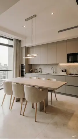 Không gian bếp hiện đại – tối giản với gam màu trung tính sang trọng. Bàn ăn gỗ dài kết hợp ghế bọc nỉ mềm tạo cảm giác ấm cúng, tinh tế. Ánh sáng tự nhiên cùng thiết kế tinh gọn giúp căn bếp trở nên đẳng cấp và thư thái. #noithathiendai #noithattoigian #bepdep #phongbep 