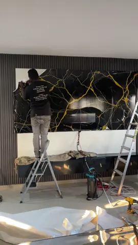 Custom Mable wrap installed on this tv unit #protinting #cladding #panenling #wrap #tvunitdesigns #lighting #wrap 