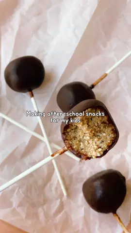 My kids think these are cake pops. 😉 Scroll down for the gist of the recipe. You can get the more detailed recipe in my free blog post: WhiteBlankSpace.com  (search for bliss ball pops) Ingredients * 1 cup 100 g rolled oats * 1 cup 140 g raw cashews * 12 pitted Medjool dates * 1/4 tsp salt * 3/4 cup coconut oil melted * 1/2 cup cocoa powder * 3 tbsp maple syrup or agave syrup Instructions Toast oats until golden. Blend oats, cashews, dates, salt, and ¼ cup coconut oil until the mix sticks when pressed. Roll into balls (2 tbsp each), insert sticks, and freeze 1 hr. Mix ½ cup melted coconut oil, cocoa powder, and maple syrup. Dip pops, let set, and repeat if desired. Wrap or store in an airtight container; refrigerate up to 2 weeks.