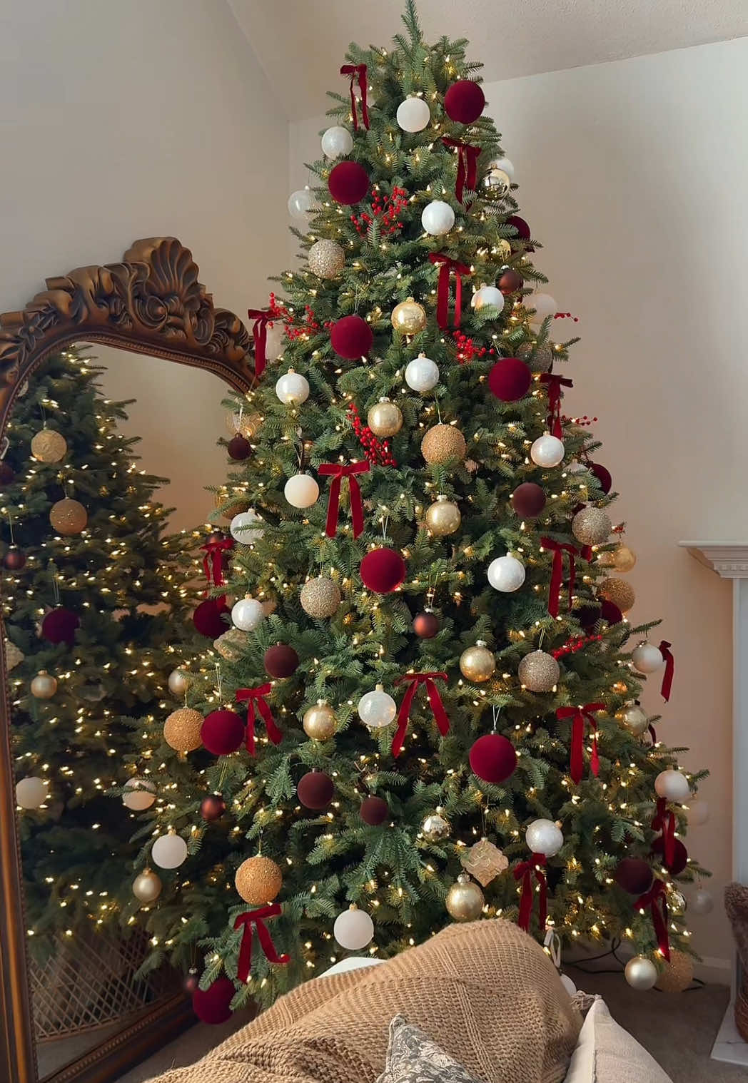 she’s here. Our 2025 Christmas tree is fully decorated and I could not be more in love 🥰  I have all of the details for what I used to decorated in my ShopMy! I really wanted to add in some reds this year and I feel like that really made the tree POP! Everytime I walk in our living room I fall more in love each time. The twinkle of the lights, the details of the ornaments, it’s all soo beautiful! I’m so obsessed with velvet bows this year so I added some reds velvet bows to the tree and they are so adorable!  #christmastreedecorating #christmas2025 #christmastreedecor #christmasdecor #christmasaesthetic  @target @HomeGoods @Amazon Home @Walmart @Balsam Hill @TJ Maxx christmas tree decor, christmas tree ornaments, red ornaments, 2025 tree reveal, 2025 christmas tree, christmas tree ideas, viral christmas tree, christmas tree trends
