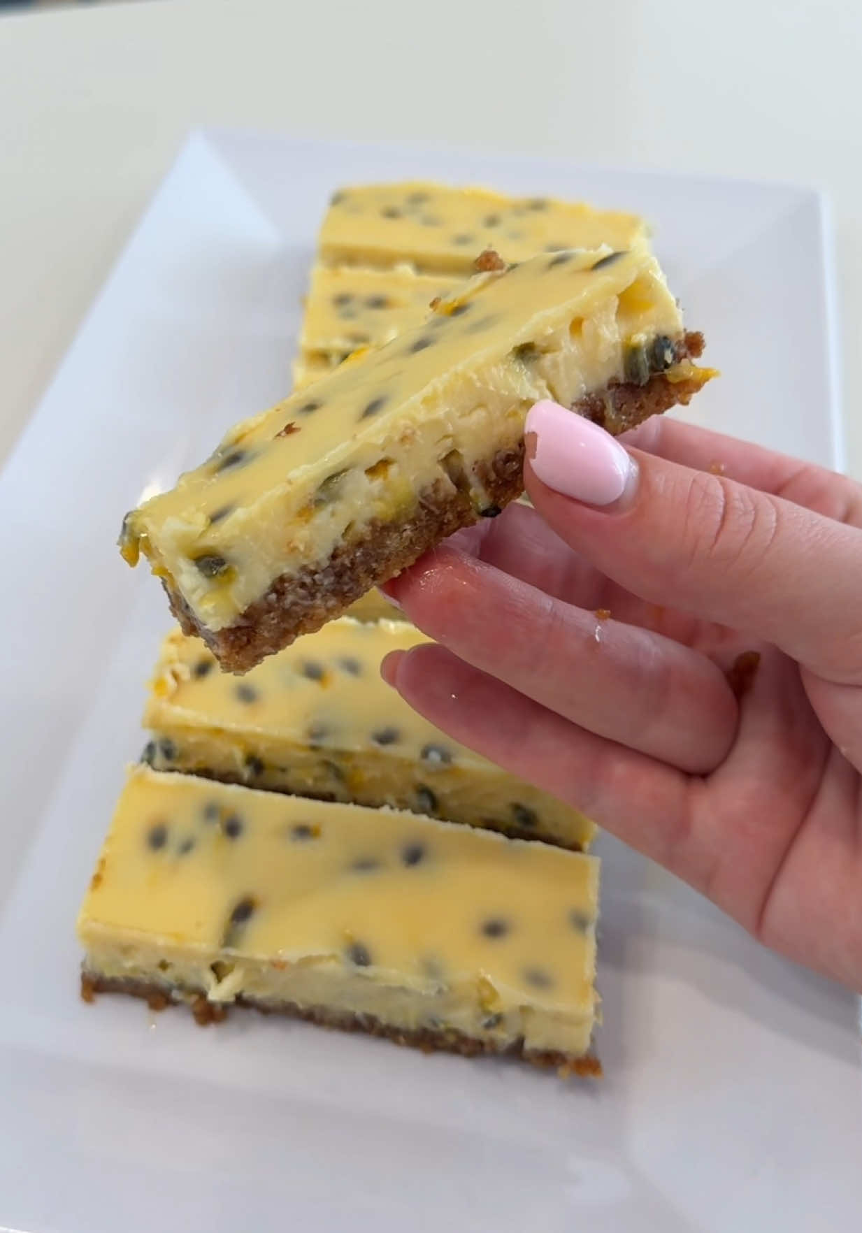 Passionfruit Condensed Milk Slice ✨ Only 5 ingredients!!  Recipe:  250g Butternut Snap Cookies  80g Unsalted Butter, melted  2 x 395g Condensed Milk  1 cup Fresh Passionfruit Pulp (around 4-5 large passionfruit)  1 Fresh Lemon, juiced  #passionfruit #slice #condensedmilk #EasyRecipes #desserttiktok 