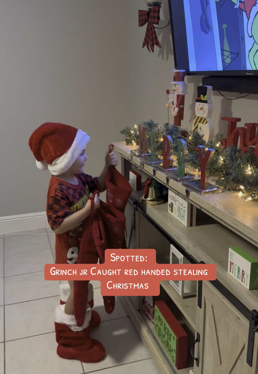 While mom was decorating the house for Christmas, little man put on his Santa gear (peep the stockings on the feet 🤣) and kept taking down our stockings 😭🤣 This kid always keeps me laughing! It’s going to be the most magical Christmas🎄💚#grinch #howthegrinchstolechristmas #toddler #toddlersoftiktok #christmas #funny #santa #stealingchristmas #funnytoddler 