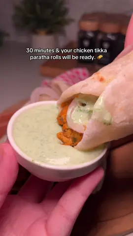 30 Days, 30 Easy Meals Part 11 : 🌯 Chicken Tikka Paratha Roll Ingredients For Chicken Marinade: 	•	250g boneless chicken (small pieces) 	•	1 tbsp ginger garlic paste 	•	Juice of 3 lemons 	•	Salt (to taste) 	•	½ tsp turmeric powder 	•	1 tsp coriander powder 	•	1 tsp red chili powder 	•	1 tsp black pepper powder 	•	1 tsp cumin powder 	•	1 tsp garam masala 	•	1 tsp kasuri methi (crushed) 	•	A pinch of food color (optional) 	•	3–4 tbsp whisked curd (yogurt) 	•	1 tbsp olive oil For Green Chutney: 	•	1 cup fresh coriander leaves 	•	2–3 green chilies 	•	2–3 garlic cloves 	•	1 tbsp lemon juice 	•	3–4 tbsp curd (yogurt) 	•	Salt to taste For Paratha Dough: 	•	2 cups flour (atta or maida) 	•	1 tsp sugar 	•	1 tsp salt 	•	3 tbsp oil 	•	Warm water (as needed for kneading) Instructions 1. Marinate the Chicken 	1.	In a bowl, add chicken, ginger garlic paste, and lemon juice. 	2.	Add all the spices — salt, turmeric, coriander, red chili, black pepper, cumin, garam masala, kasuri methi, and a pinch of food color. 	3.	Add whisked curd and olive oil. 	4.	Mix well so all pieces are coated evenly. 	5.	Marinate for at least 30–60 minutes. 2. Cook the Chicken 	1.	Heat a little oil in a pan over medium flame. 	2.	Add the marinated chicken and cook until it’s tender, juicy, and slightly charred. 	3.	Set aside. 3. Make the Green Chutney 	1.	In a blender, add coriander leaves, green chilies, garlic cloves, lemon juice, curd, and salt. 	2.	Blend into a smooth paste. Adjust consistency with a little water if needed. 4. Prepare the Parathas 	1.	In a bowl, add flour, sugar, salt, and oil. Mix well. 	2.	Gradually add warm water and knead into a soft, smooth dough. 	3.	Let it rest for 15–20 minutes. 	4.	Divide the dough into small portions and roll out small parathas. 	5.	Cook on a tawa with a little oil until golden brown on both sides. 5. Assemble the Roll 	1.	Place a paratha on a plate. 	2.	Spread green chutney evenly. 	3.	Add cooked chicken pieces on top. 	4.	Optionally, add sliced onions or a drizzle of lemon juice. 	5.	Roll it up — and your Chicken Tikka Paratha Roll is ready to serve! 🌶️🥙#chickenrecipes #foodreels #tiktokviral #tiktokpakistan #tiktokindia 