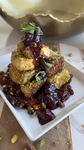 Pistachio-Crusted Halloumi with Fig Crispy, nutty, and sweet, this appetizer is a flavor explosion. Pistachio-crusted halloumi pairs perfectly with the rich sweetness of figs and a tangy balsamic glaze. Ingredients: *  Halloumi cheese *  Butter or garlic butter *  Pistachios, plus extra for garnish *  Fig *  Cinnamon *  Lemon *  Balsamic glaze *  Cranberries *  Fresh oregano, for garnish Instructions: 1.  Cut the halloumi into your desired shape. 2.  Add garlic butter to a pan and fry the halloumi until golden brown. Remove the halloumi from the pan and set aside. 3.  In the same pan, add pistachios and the cut figs. Squeeze the juice from half a lemon over the figs and pistachios. Add cinnamon, balsamic glaze, and cranberries. Let all that simmer until the figs soften and the sauce thickens slightly. 4.  Put the fried cheese on the crushed pistachios. 5.  Put the mixture of the fig and the glaze on the plate in the bottom, then stack the cheese that is put on the pistachios first. 6.  Stack them up and then add the glaze from the top and garnish with fresh oregano. Serve immediately  Enjoy  #sweetandsavory #healthyfood #foryou #nutrition #Ramadan 