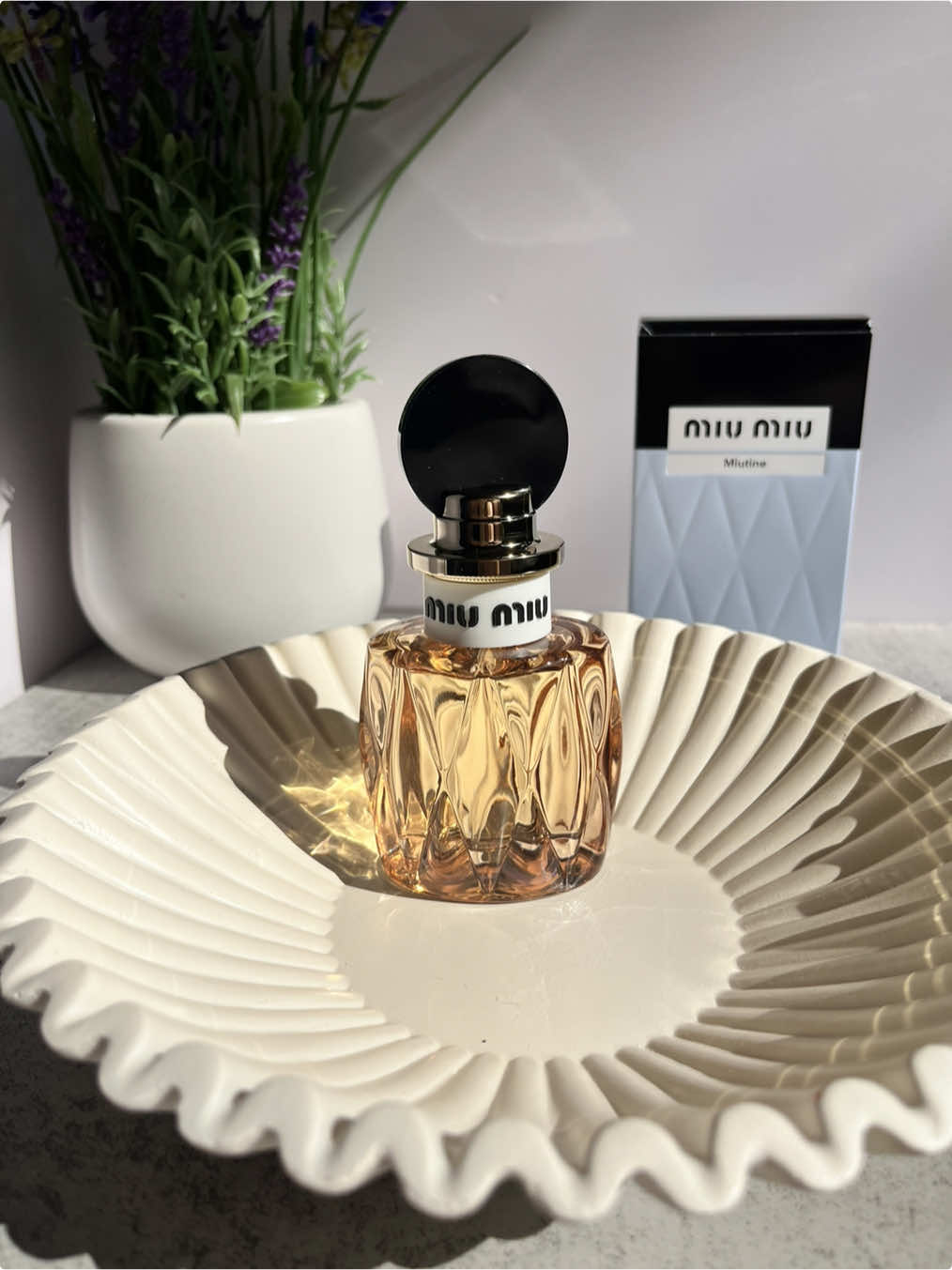 Come Unbox With Me A New Fragrance, Miu Miu Miutine, the new feminine fragrance from Miu Miu Beauty, captures the ultimate essence of the Miu Miu woman—irreverent, youthful in spirit, and unconventional. Encapsulated in a toffee-toned crafted Matelassé glass, the bottle is a tribute to the iconic Matelassé leather of the Miu Miu house. Imagined by master perfumer Dominique Ropion, Miutine is a twist of the codes, a gourmet cheekiness rendered in fragrance. Featuring a teasing top burst of a bright wild strawberry accord. A milky gardenia for her retro-inspired charm. A sweetly provocative blend of brown sugar, vanilla, and patchouli oil for her unconventional femininity.  ASMR Unboxing  @Miu Miu #giftedbymiumiu #miumiubeauty #miutinebydefintion #unboxing #perfumetiktok 