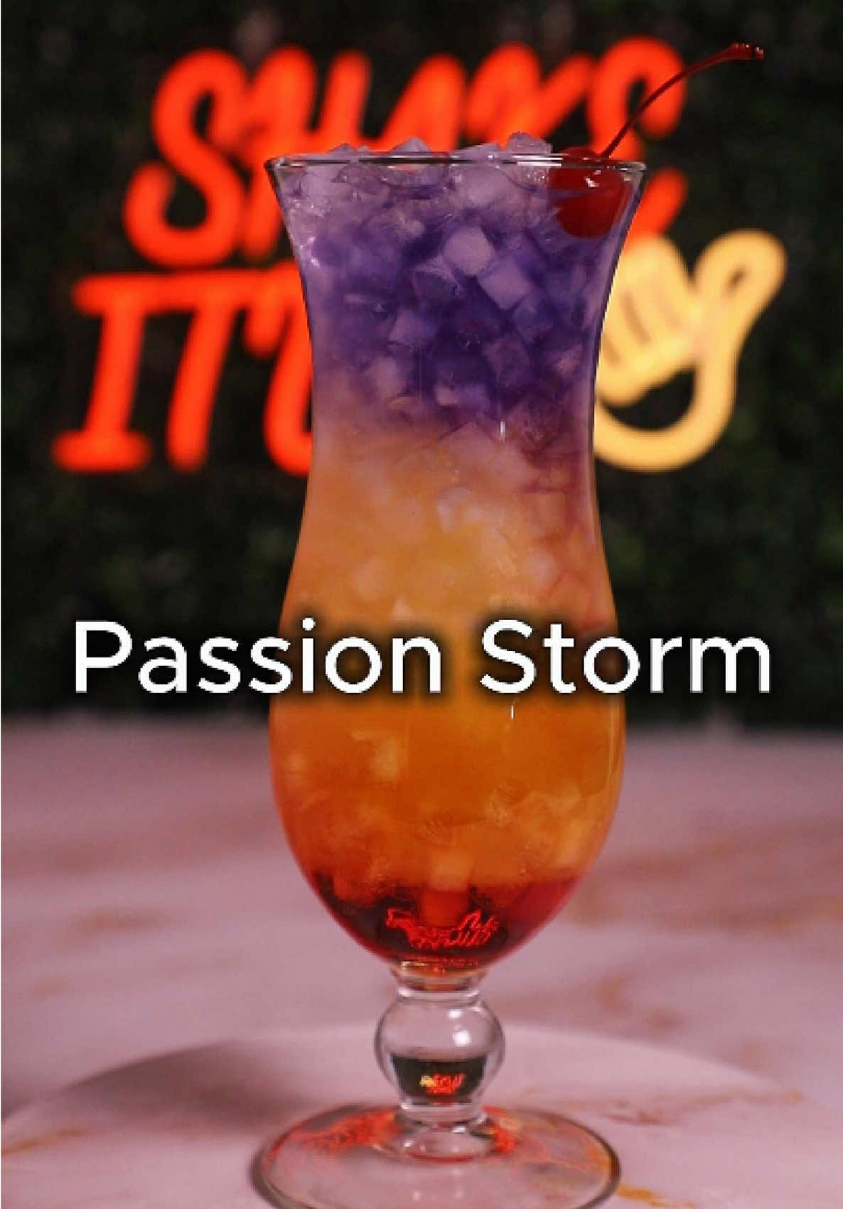 🌀 Part 171 – Passion Storm 🍒✨ A tropical tempest in a glass — Passion Storm blends the bold kick of tequila with the exotic tang of passionfruit, cascading over a grenadine sunset and crowned with a violet sky of butterfly pea tea. Sweet, tart, and dramatic, it’s a storm you can sip — layered for the camera, built for the tropics. ⸻ 📝 Ingredients: • 1 ½ oz Tequila Blanco • 1 oz Triple Sec • 2 oz Passionfruit Juice • ½ oz Grenadine • 1 oz Butterfly Pea Flower Tea (chilled) • Optional: ¼ oz Simple Syrup (if you want it sweeter) 🍹 Glass: Hurricane 🧊 Ice: Crushed ice (build in glass) 🧪 Method: 	1.	Add grenadine to the bottom of the hurricane glass. 	2.	Fill the glass almost to the top with crushed ice. 	3.	Slowly pour tequila, triple sec, and passionfruit juice over the ice to create a golden–sunset middle layer. 	4.	Gently float butterfly pea tea on top using the back of a spoon for that purple sky effect. 	5.	Add more crushed ice if needed to lift the layers. 🍒 Garnish: Single cherry on top  #cocktails #fyp #foryoupage #trending #viral 