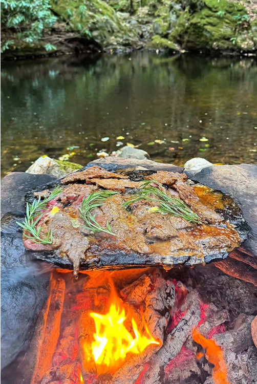Premium beef steak cooked on hot rocks in nature 🥩💦🪵🔥 #cookingasmr #leon #outdoorcooking #beef #steak 