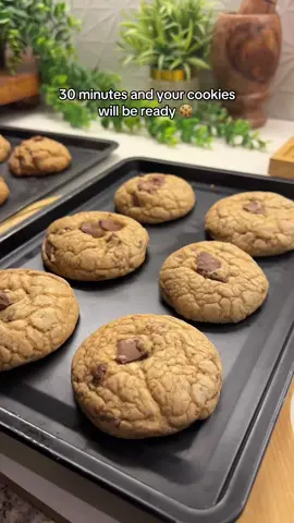 Soft NYC-Style choclate chip Cookies Ingredients: 	•	125 g butter (softened) 	•	½ cup brown sugar 	•	⅓ cup granulated sugar 	•	1 large egg 	•	1 tsp vanilla essence 	•	1¾ cups + 2 tbsp all-purpose flour 	•	½ tsp salt 	•	1½ tsp baking powder 	•	½ tsp baking soda 	•	Chocolate chunks or chips (as desired) ⸻ Method: 	1.	Preheat the oven: Set your oven to 180°C (350°F). Line a baking tray with parchment paper. 	2.	In a large bowl, add butter, brown sugar, and granulated sugar. Beat with an electric beater for 2–3 minutes until light and creamy. 	3.	Add 1 large egg and 1 tsp vanilla essence, and beat again until well combined. 	4.	In another bowl, sift together the flour, salt, baking powder, and baking soda. 	5.	Combine wet and dry: Switch to a hand whisk or spatula and gently fold the dry ingredients into the butter mixture. Mix until just combined — don’t overmix. 	6.	Add chocolate: Fold in chocolate chips or chunks evenly through the dough. 	7.	Bake: Scoop out portions of dough onto the prepared tray (leave space between cookies). Bake for 12–14 minutes at 180°C, until the edges are lightly golden but the center is still soft. 	8.	Cool and enjoy: Let the cookies rest on the tray for a few minutes before transferring to a wire rack. Enjoy your soft, buttery choclatey NYC-style cookies! 🍪 #cookies #bakingathome #foodblogger #Nyc #foodasmr 