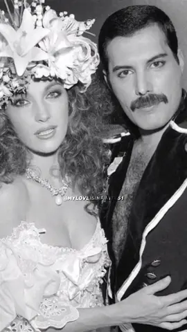 5 November 1985 - Freddie Mercury in a show-stealing moment with the lovely Jane Seymour during Fashion Aid  “I was the bride, Freddie Mercury got married with me in front of millions of people ...(of course it was staged 😉) Freddie looked very dapper.  I had the most amazing hair and makeup, of course in those days, the whole idea of very frizzy, full hair was in.   The headdress I was wearing weighed a ton, it was all real flowers.  I remember it sticking in my head and I couldn’t wait to get it off, it was so heavy.  The flowers I was carrying were very heavy too.  It was a magical moment!   Freddie is not only incredibly talented but a very lovely man.   My favorite song by Queen is Bohemian Rhapsody.” - Jane Seymour on her Fashion Aid moment ♥️🌹 Fashion Aid - 5th November 1985, bringing top artistic talent from the fashion world and the world of music to raise funds for Ethiopia. The event featured 35 hairdressers, 60 makeup artists, 120 dressers, 125 models and celebrities from the entertainment world. The spectacular staged wedding took place at the Albert Royal Hall in London.  Jane Seymour sauntered out in a white lace wedding gown tied up with bows designed by the Emanuels. Accessorised with a flower crown made of daisies and lilies, She made her way down the runway and planted a theatrical kiss on the lips of Freddie Mercury in front of 5,500 guests.  Their vows were sealed and Mercury then took off down the catwalk with the massive bridal bouquet, throwing blossoms to the delighted crowd.  It was all fun and for a good cause as well (organized by Bob Geldof to fight famine in Ethiopia).   Astonished hotel guests recognized the couple and photographed them, believing they were witnessing a celebrity wedding. Freddie, finding it very amusing, did nothing to dissuade them.  He did suggest they should change their clothes….! 😂  Another Show-Stealing moment by Freddie Mercury himself! So many gorgeous photos and video😍 🎥 Content owned by @officialqueenmusic Queen Productions LTD No copyright infringement intended #freddiemercury #myheart #foryou #fypシ #liveaid