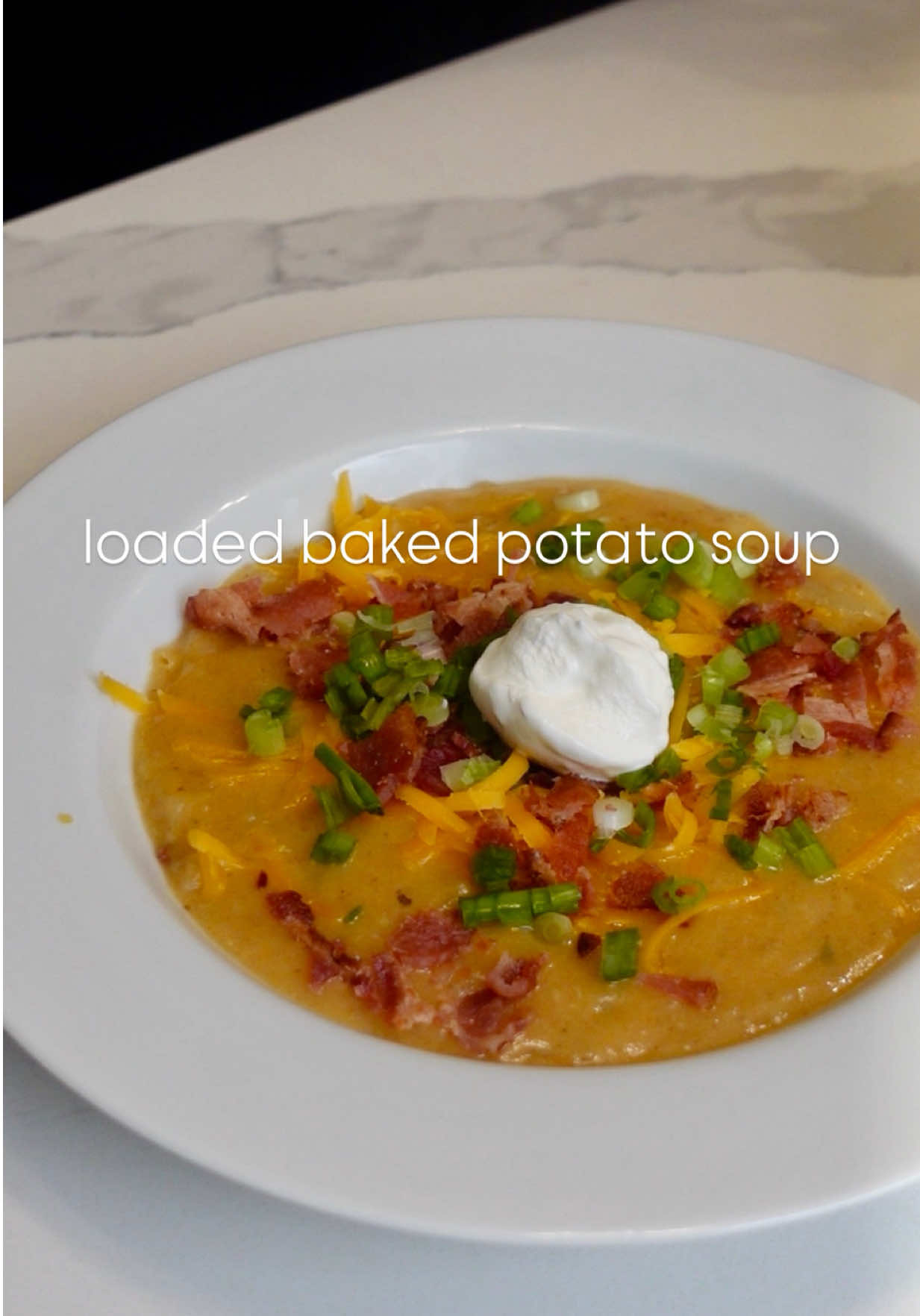 baked potato soup ingredients: 4 russet potatoes olive oil salt  6 slices bacon 1 onion, diced 4 garlic cloves, minced 4 tablespoons butter 4 tablespoons all-purpose flour  4 cups broth 1 cup milk  1 tsp salt 1 tsp black pepper  1 tsp Cajun seasoning  1 tsp smoked paprika 1/2 tsp garlic powder  1/2 tsp onion powder  1 cup shredded medium cheddar Toppings: shredded cheese, bacon, sliced green onion, sour cream. Directions: 1. Preheat oven to 400F. Scrub and rinse the potatoes. Use a fork to poke several holes all around the surface of the potatoes. Drizzle with olive oil and sprinkle with salt. Place potatoes directly on the top oven rack with a baking sheet at the bottom rack to catch any drippings. Bake for about 1 hour. 2. Into a large pot place the bacon then turn on the heat. Cook bacon until crispy then transfer to a paper towel lined plate. Discard all but 2 tablespoons of the bacon grease then sautee the diced onion for about 5-7 minutes. Add the minced garlic and sautee for another minute. 3. Add the butter then add the flour. Stir and let cook for 1 minutes. Slowly add the broth while stirring until there are no lumps. Add the milk and seasoning, let simmer on low heat for 10 minutes.  4. In the meantime, carefully cut potatoes in half and scoop it out. Add to soup. Use an immersion blender or potato masher until potatoes have reached your desired consistency. Add the shredded cheese and stir. Adjust seasoning to taste and add more broth or milk as needed. 5. Serve with desired toppings and enjoy!