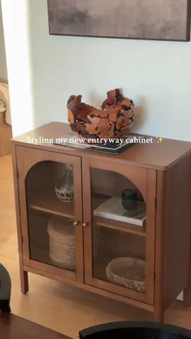 Added a little spice to our entryway with this adorable Wood Curio Cabinet with Glass Doors in brushed light brown from @Nathan James Home ✨🤌🏻 #nathanjamesfurniture 