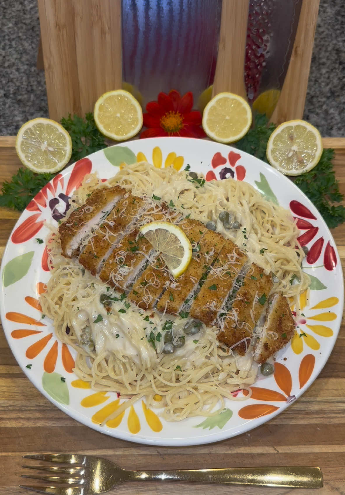 Crispy Chicken Piccata Pasta🍋 Start out by adding flour to one bowl, and in another bowl add 1 part Italian bread crumbs and 1 part thinly shredded Parmesan cheese Generously season both with: -lemon pepper -granulated garlic -chicken bouillon powder  Then get some chicken breast cutlets and dip each into the flour, then into whisked eggs, and pack on the breadcrumbs.  Fry them on medium heat in high heat oil until they’re golden brown, letting them rest on a cooling rack.  And for the sauce, in a pan on medium heat add: -4 tablespoons of butter  -1/4 cup of flour  Whisk until it’s smooth then add: -1 tablespoon of minced garlic  -1/4 cup of drained and rinsed capers  -1 cup of white wine  -2 cups of chicken broth  -1 cup of heavy whipping cream  -and then season with chicken bouillon powder and lemon pepper.  *make sure to whisk in between adding each ingredient  Let this simmer for a couple of minutes, stirring frequently (he sauce will thicken as it cooks and cools.)  Add the juice from one lemon, then turn off the heat. You can add more lemon juice if you prefer.  Then add your desired amount of sauce to 1 pound of cooked pasta (I use angel hair.) When serving, top the pasta with your chicken (sliced into strips), fresh parsley, parmesan cheese, and extra sauce if you want.  Enjoy💜 #Recipe #food #cooking #DinnerIdeas #pasta 