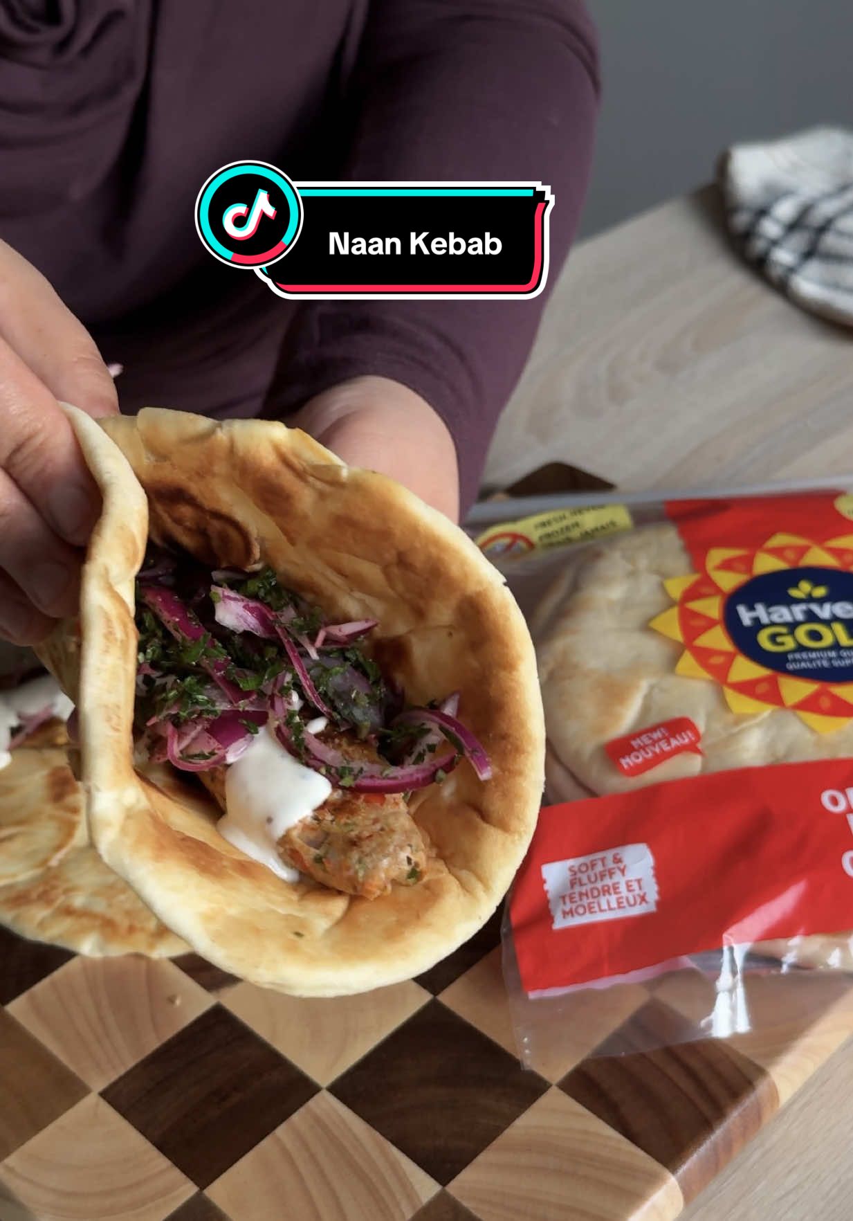 Naan Kebab Wrap made with Harvest Gold Butter Naan. #AD  Took under 30 minutes and turned about absolutely 🔥💯 MUST TRY !!!  Harvest Gold now available at yor nearest grocery stores in 🇨🇦🍁 Ingredients: For Kebab ⁃ chicken mince ⁃ Onion ⁃ Red bell pepper ⁃ Garlic ⁃ Lemon ⁃ Parsley or coriander ⁃ extra virgin olive oil ⁃ Salt, paprika, cumin & coriander powder ⁃ Chilli flakes  For Pickled Sumac Onions : ⁃ Red onion - Sumac & Salt ⁃ Lemon ⁃ Olive oil ⁃ Parsley For Garlic Sauce :  - Greek yogurt  - Mayonnaise  - Minced garlic  - Salt,  pepper & parsley  ⁃ Harvest Gold Naan ⁃ Butter #EasyRecipe #harvestgoldnaan #notyouraverageindianfood #browntiktok 