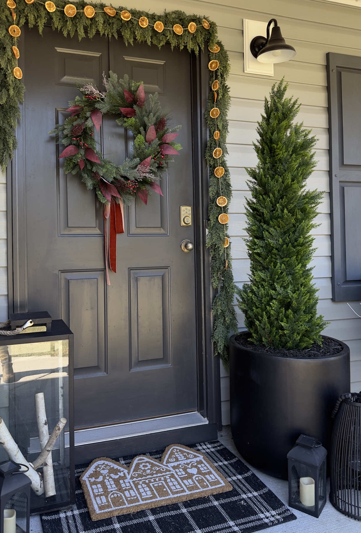 This is my most viewed video ever and it’s going viral again at just the right time, because these trees are back in stock for Christmas!😍🎄  Follow along and find links in my LTK shop for the spray I used and other porch decor! Answering some FAQs: I used the 1.5ft trees and stacked them to get varying heights. I used 18 trees total on my porch. The key is twisting the branches from each stacked tree together tightly at the stem of the tree! I’ve had these same ones for 3 years on my covered porch (not exposed to rain) and recommend using something heavy on the base either in a planter or under a “tree skirt” if you get a lot of wind! For along for more affordable Christmas decor and easy DIYs! #christmasdiydecor #diychristmastree #christmasporchdecor Dollar tree diy decor, flocked Christmas tree diy, Christmas front porch, mini Christmas trees, budget Christmas decor, how to diy a flocked tree, holiday decor hacks